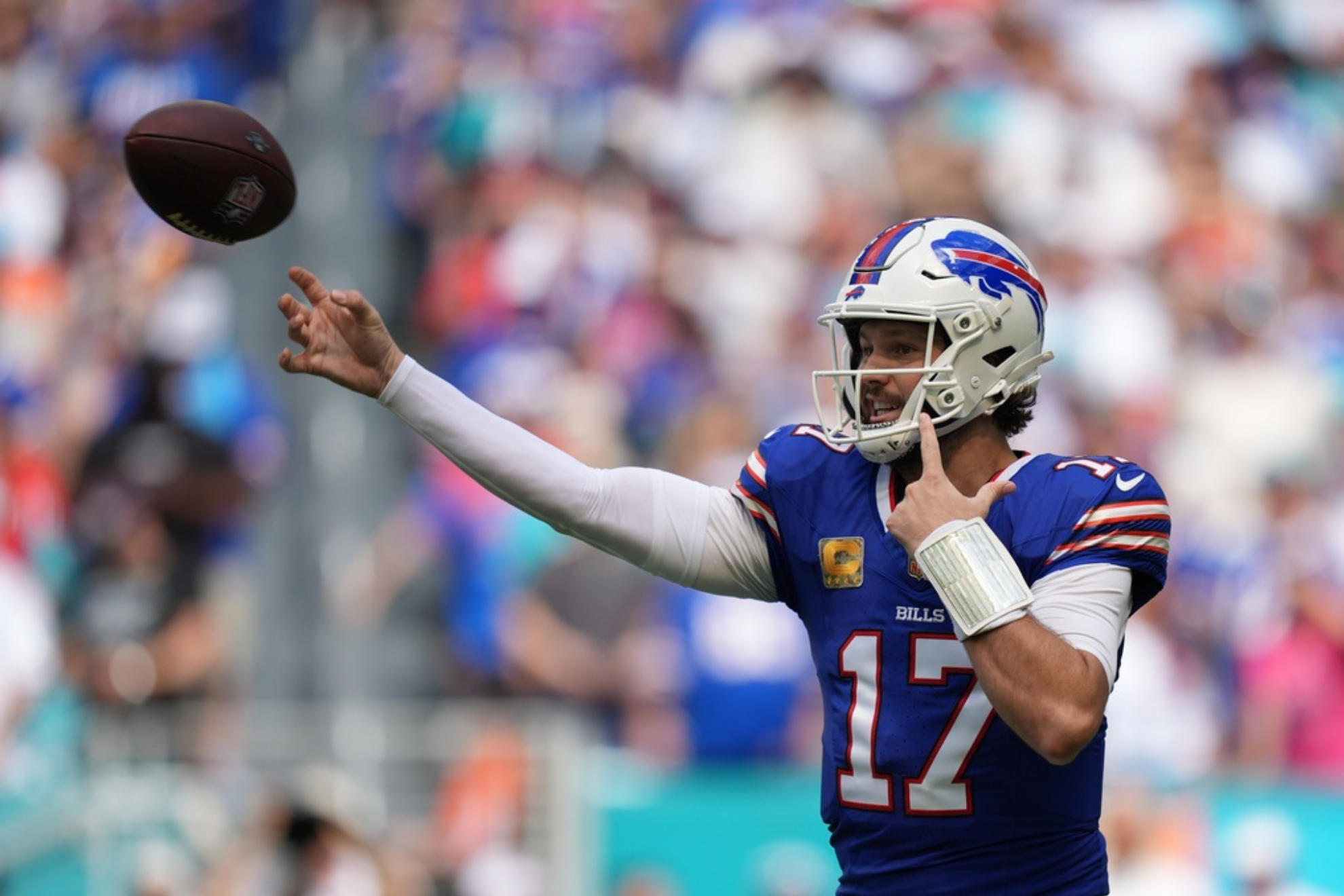 Buffalo Bills quarterback Josh Allen throws during the first half of an NFL football game against the Miami Dolphins,