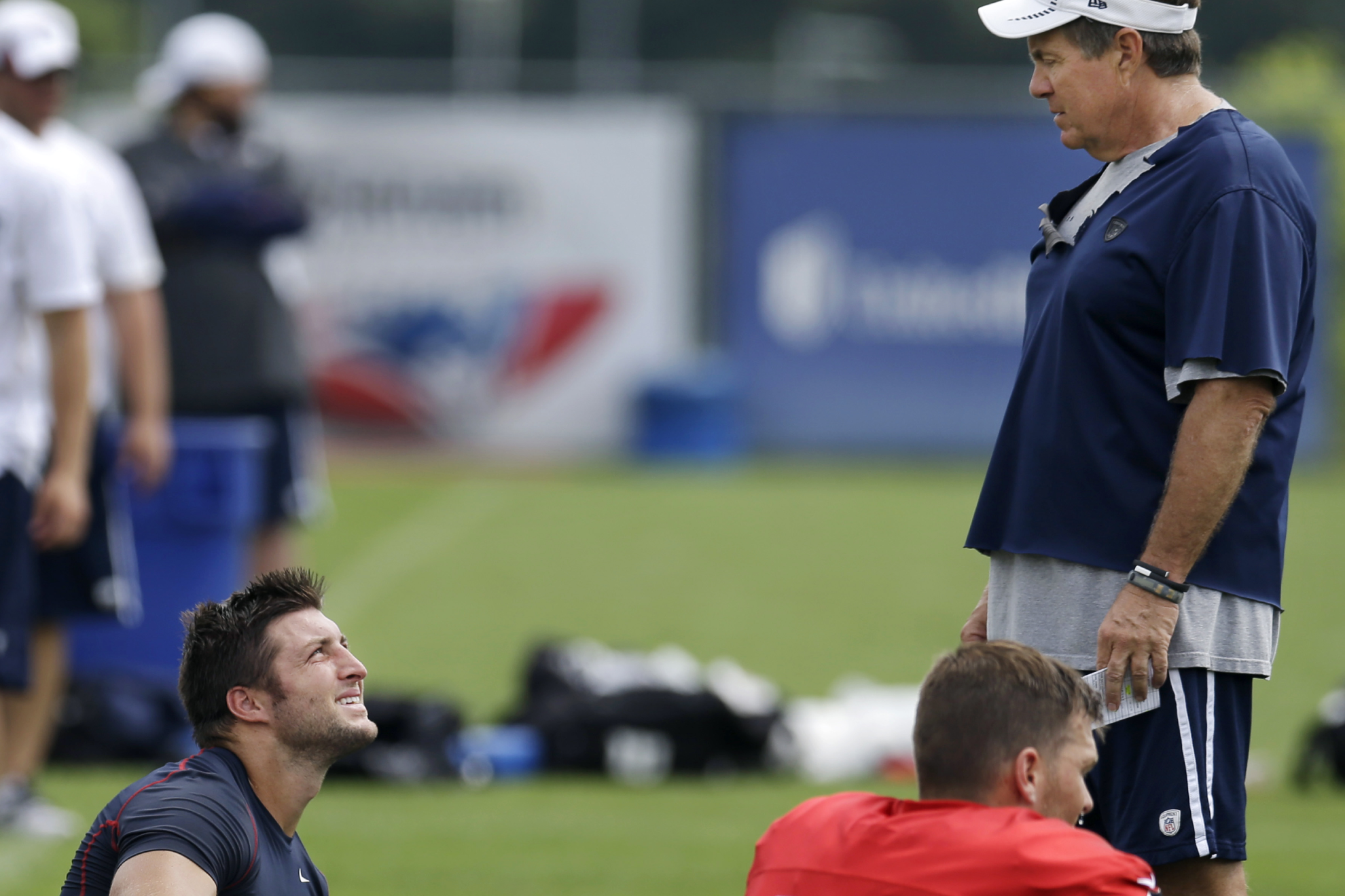 Tim Tebow and Bill Belichick, pictured in 2013, worked together while at the New England Patriots