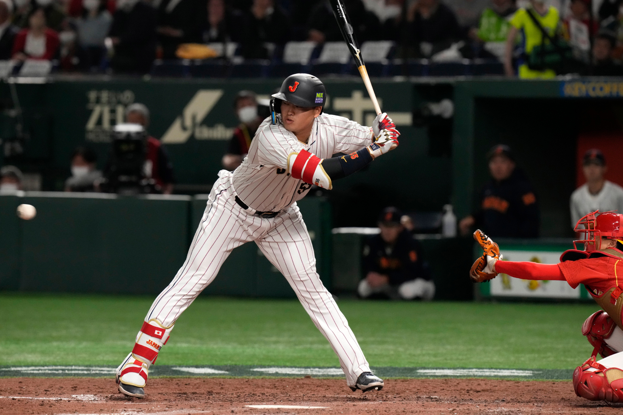 Munetaka Murakami of Japan avoids a pitch in the fourth inning of the Pool B game between Japan and China, at the World Baseball Classic (WBC) in Tokyo, Japan, Thursday, March 9, 2023.