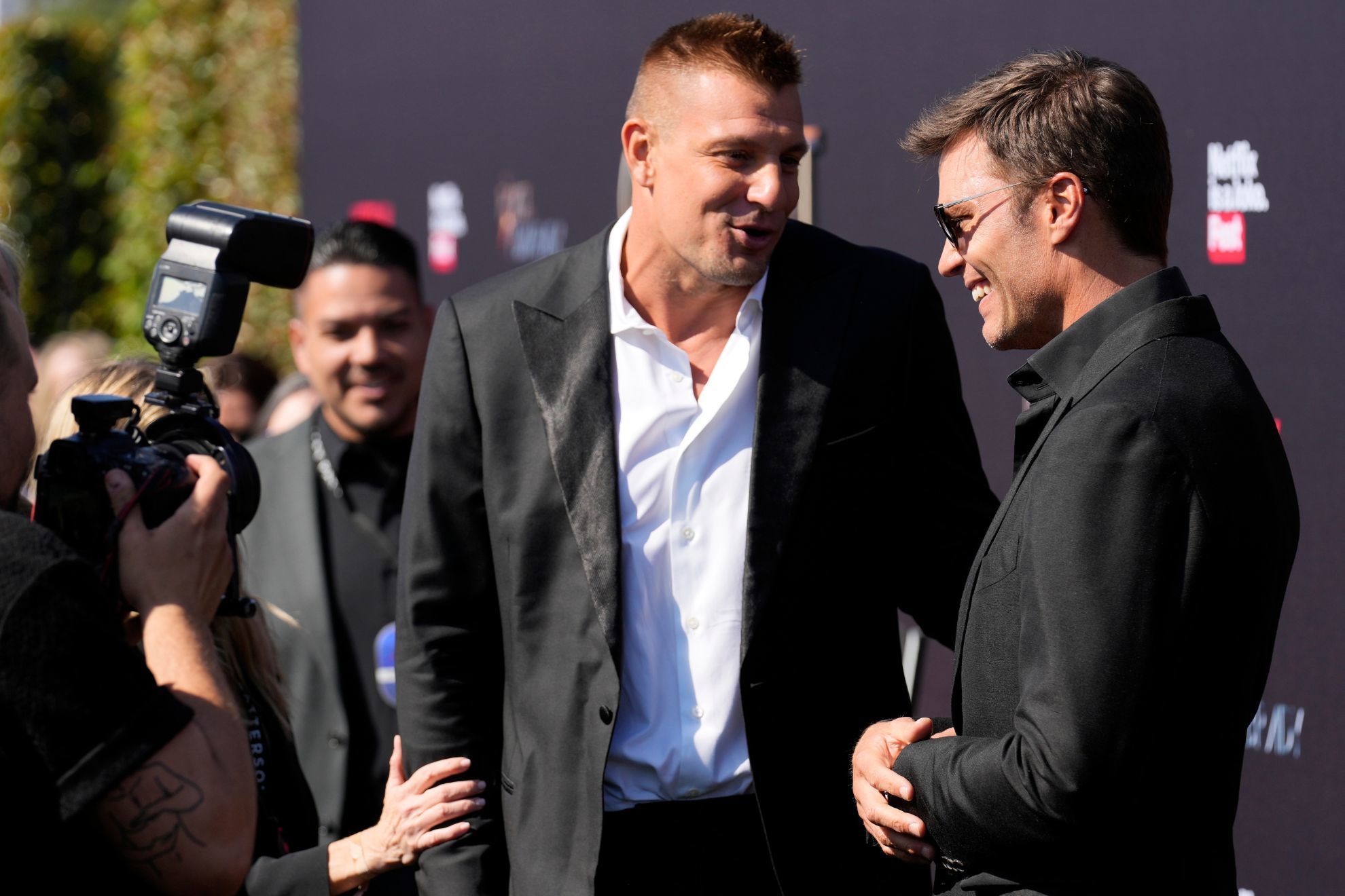 Rob Gronkowski (l) retired in 2019 after winning three Super Bowls in nine years.