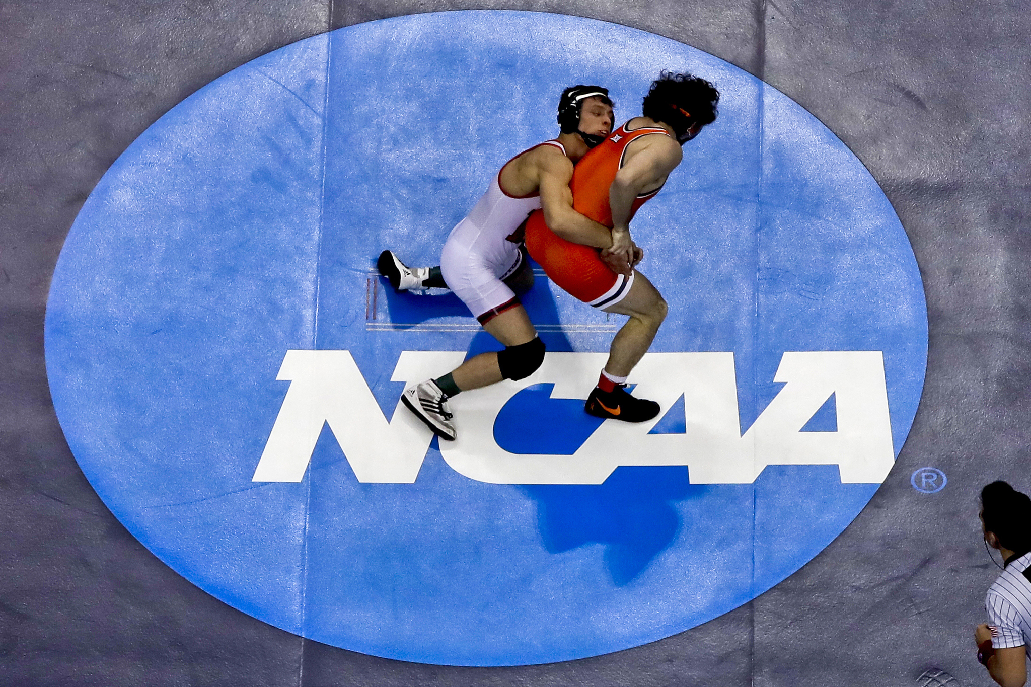 Rutgers Nick Suriano, left, works to control Oklahoma States Daton Fix (not involved in case)