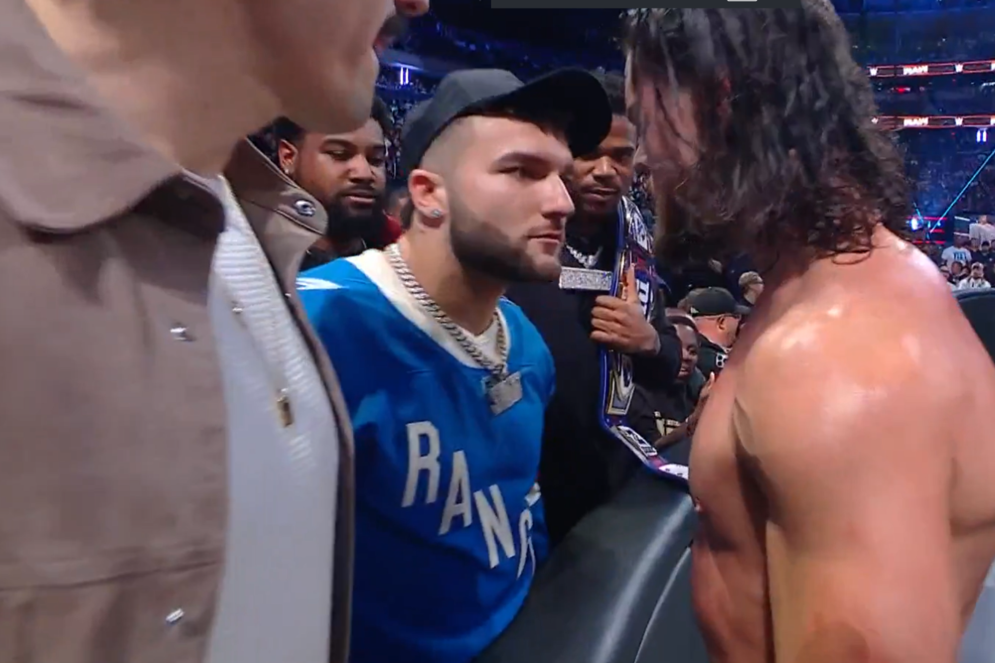New York Giants rookie Cam Skattebo squares up to Dominik Mysterio at a WWE event