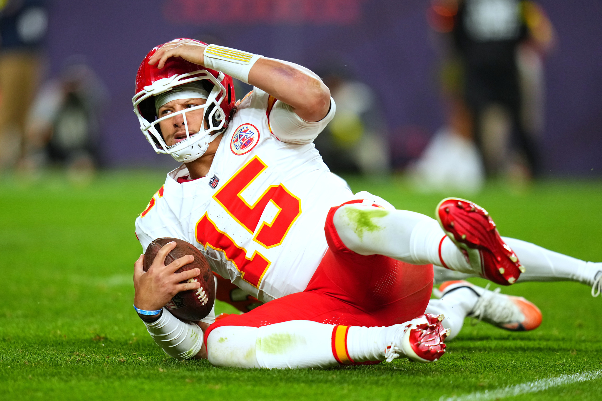 Kansas City Chiefs quarterback Patrick Mahomes (15) reacts after being sacked during an NFL game against the Denver Broncos
