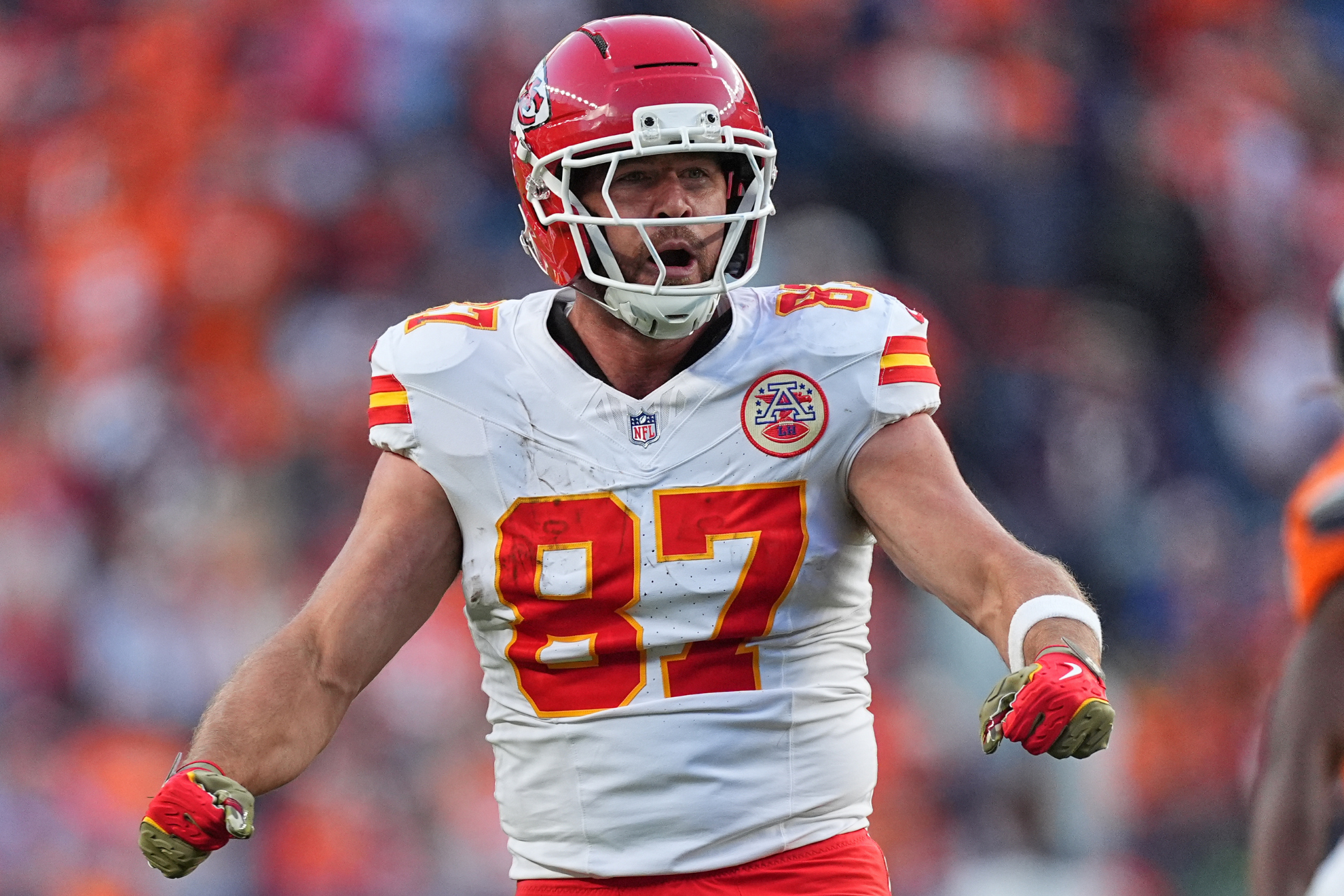 Travis Kelce celebrates after picking up a first down during a Kansas City Chiefs game.