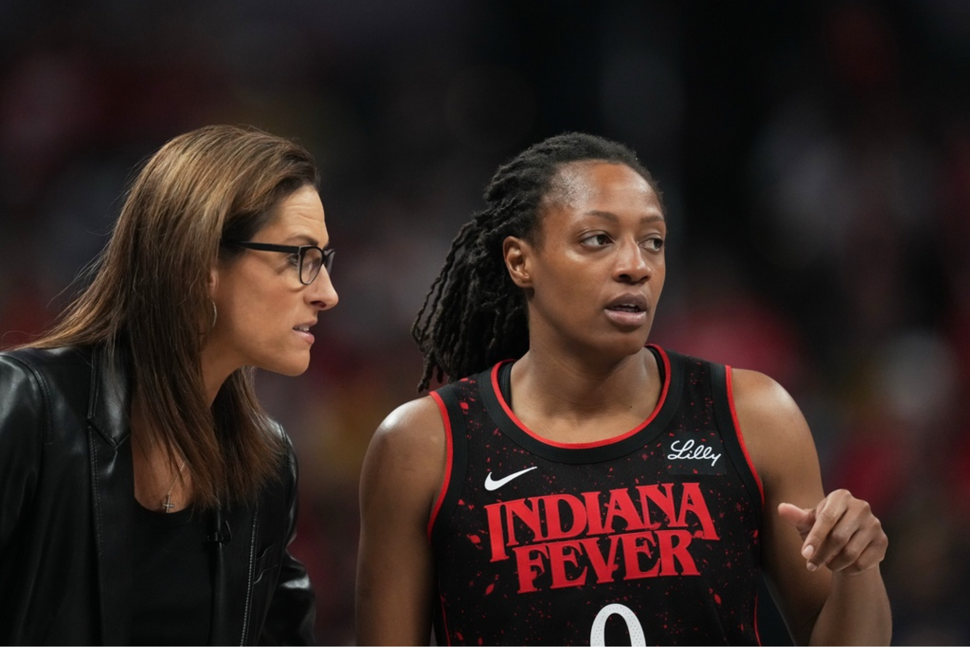 Indiana Fever head coach Stephanie White talks with Kelsey Mitchell