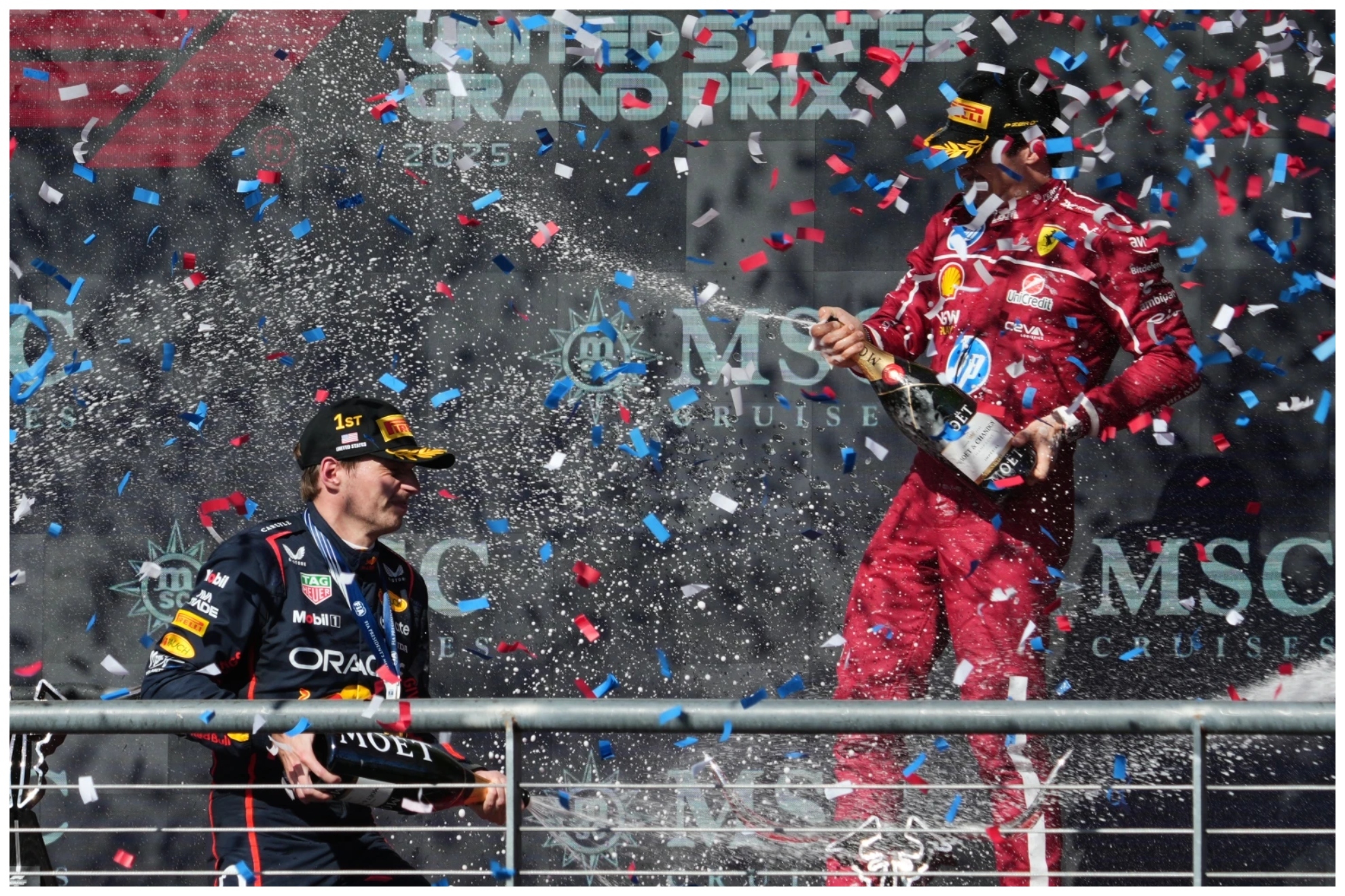 Max Verstappen celebrating with Charles Leclerc after a F1 GP