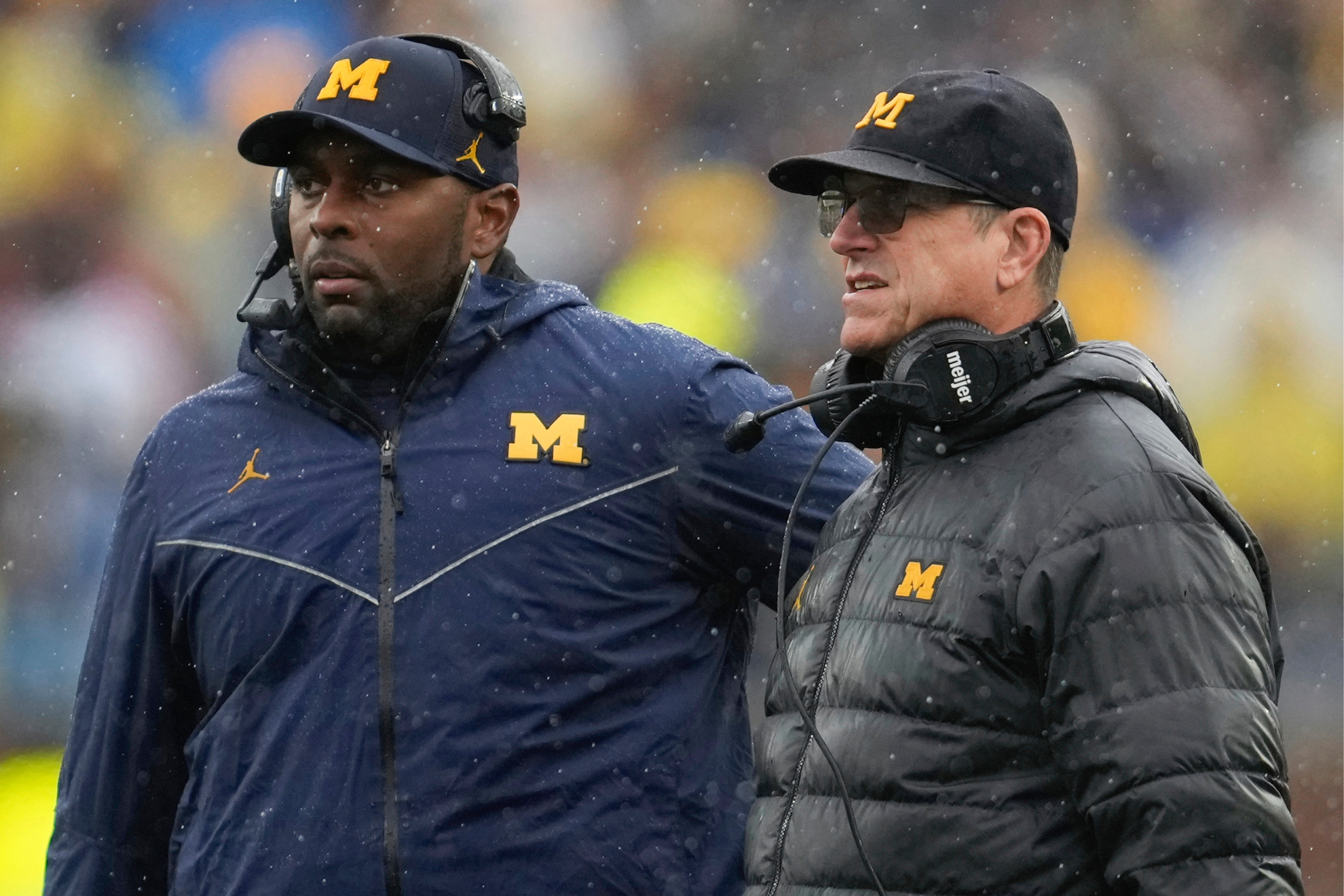 Sherrone Moore and Jim Harbaugh worked together on the same coaching staff at the University of Michigan.