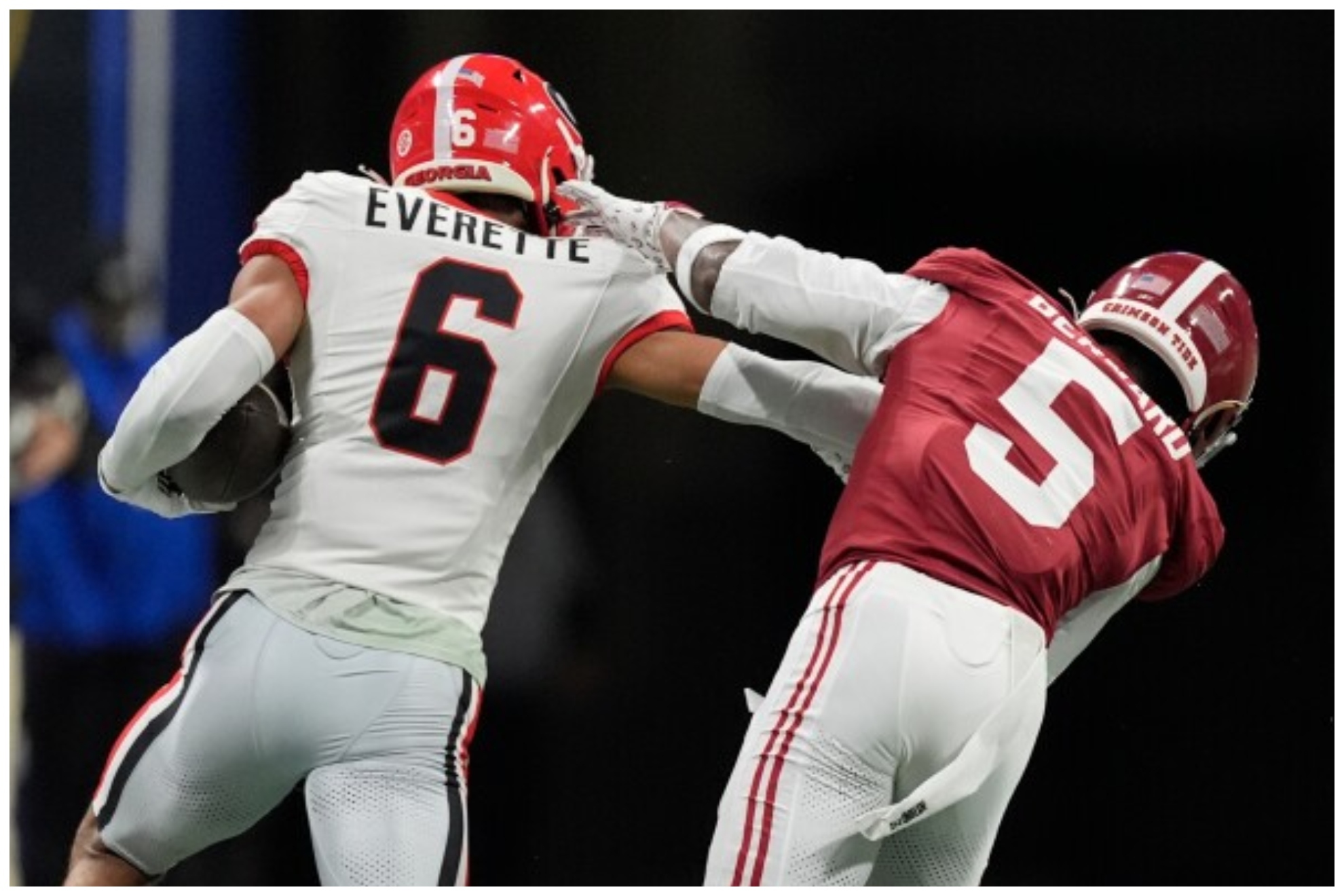 Georgia defensive back Daylen Everette (6) runs an intercepted ball against Alabama wide receiver Germie Bernard (5) during the first half of a Southeastern Conference championship NCAA college football game