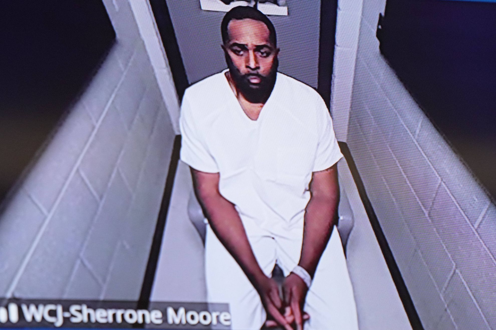 Former Michigan Wolverines head coach Sherrone Moore appears in court via video after being taken into custody for several charges.