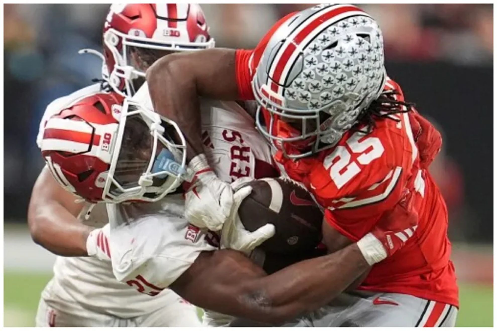 Indianas Louis Moore tries to stop Ohio States Bo Jackson during the second half of the Big Ten championship NCAA college football game in Indianapolis, Saturday, Dec. 6, 2025.