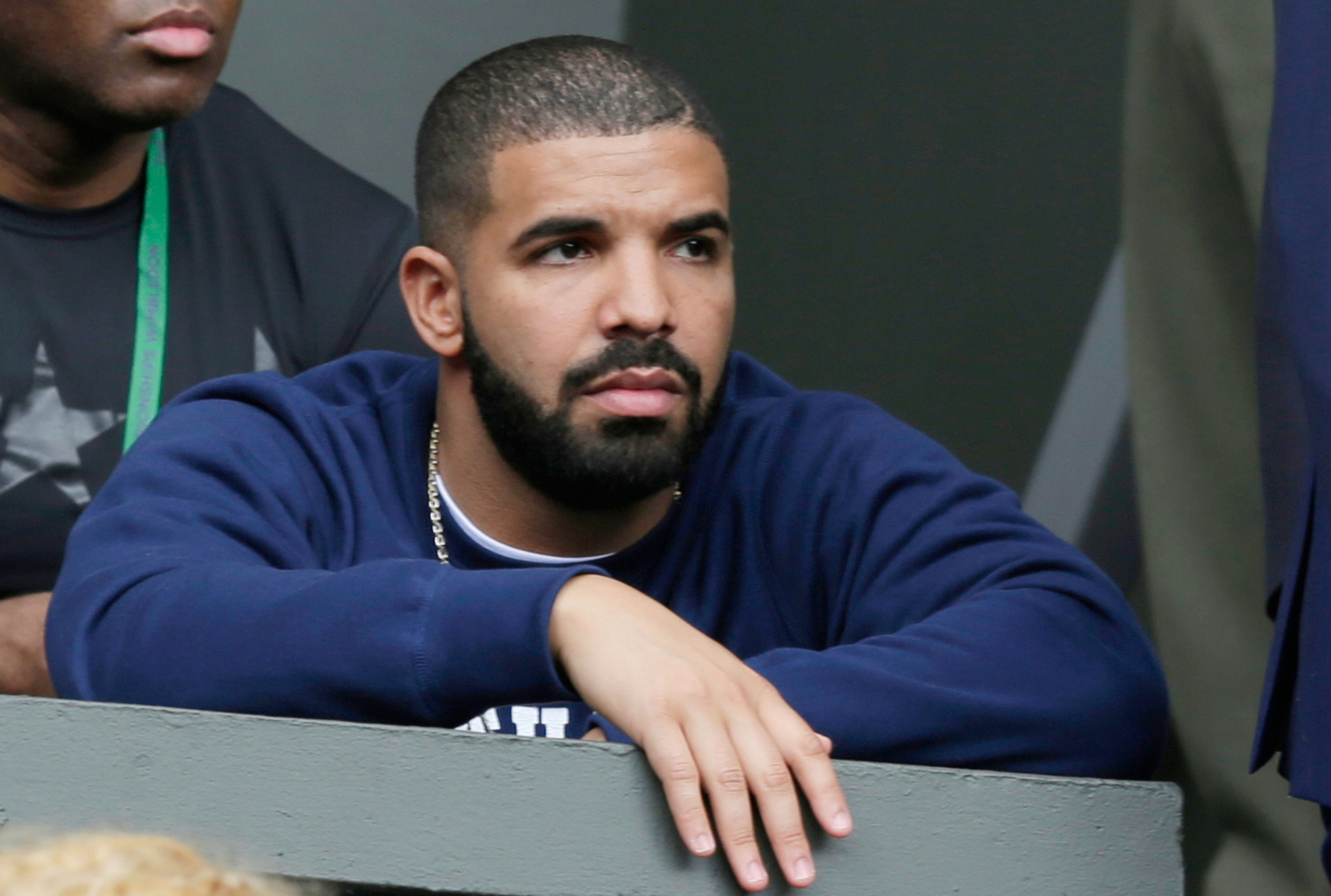 Aubrey Graham at a tennis game that he bet on and lost.