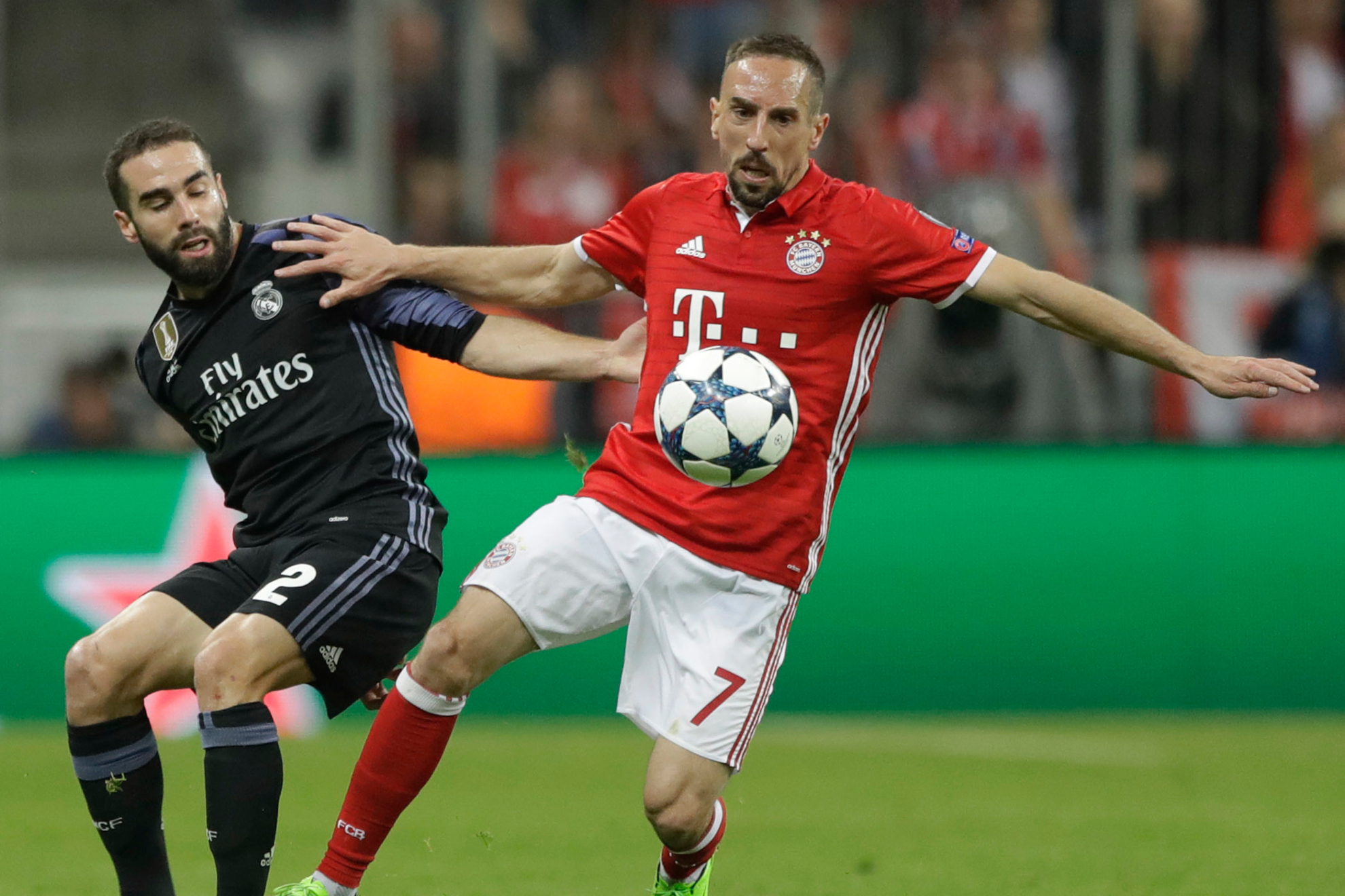 Real Madrids Dani Carvajal fights for the ball against Bayerns Franck Ribery during the Champions League quarterfinal first leg soccer match between FC Bayern Munich and Real Madrid, in Munich, Germany, Wednesday, April 12, 2017.