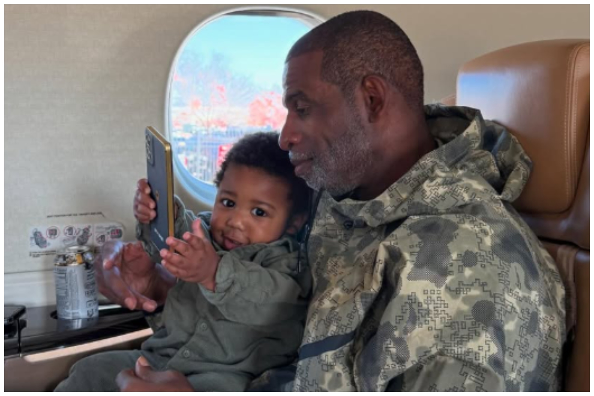 Deion Sanders and his grandson Snow