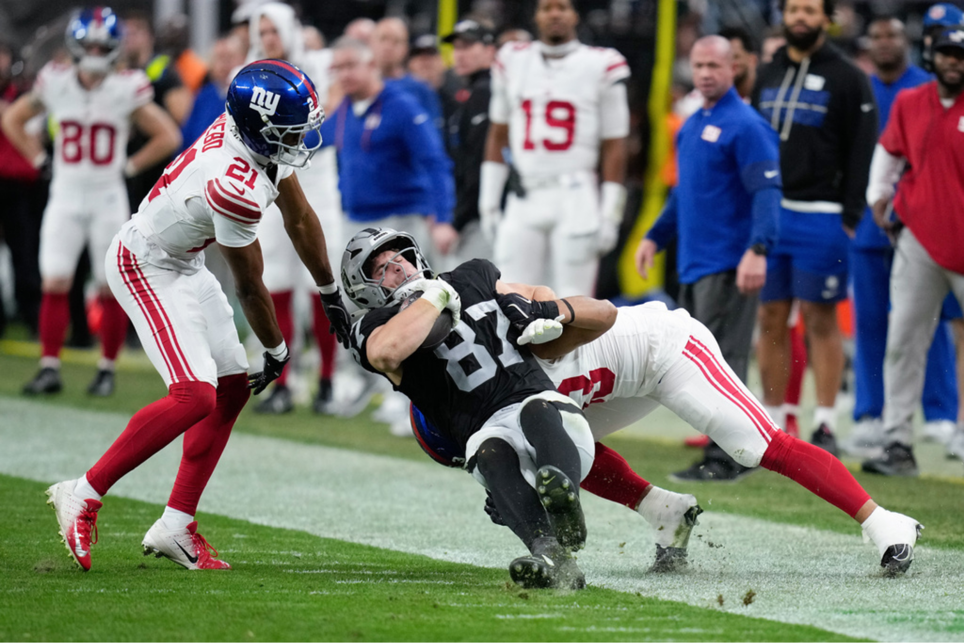 Las Vegas Raiders tight end Michael Mayer is brought down by New York Giants linebacker Darius Muasau