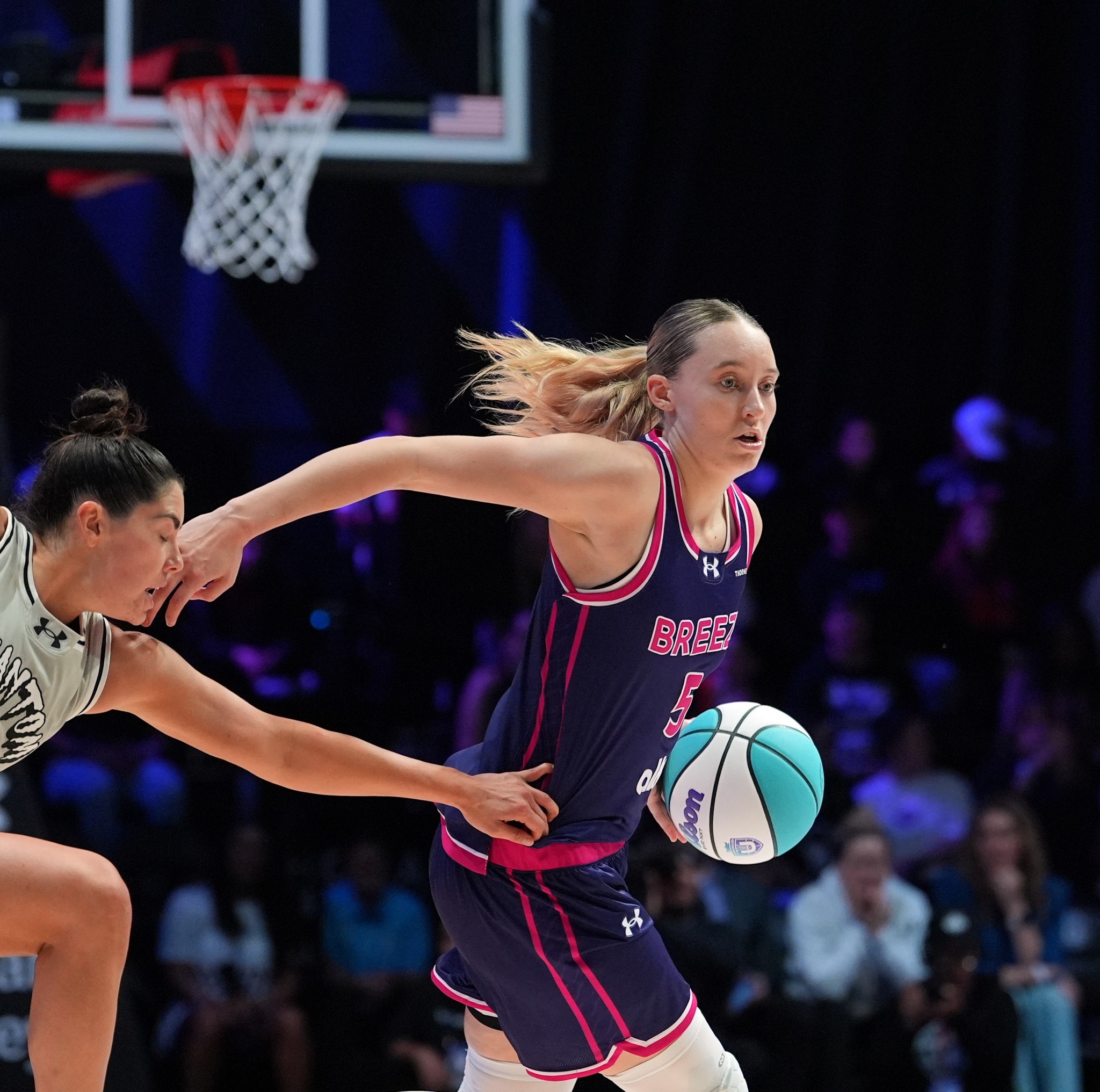 Breeze BC guard Paige Bueckers (5) is pursued by Phantom BC guard Kelsey Plum (10) in their Unrivaled 3-on-3 basketball game