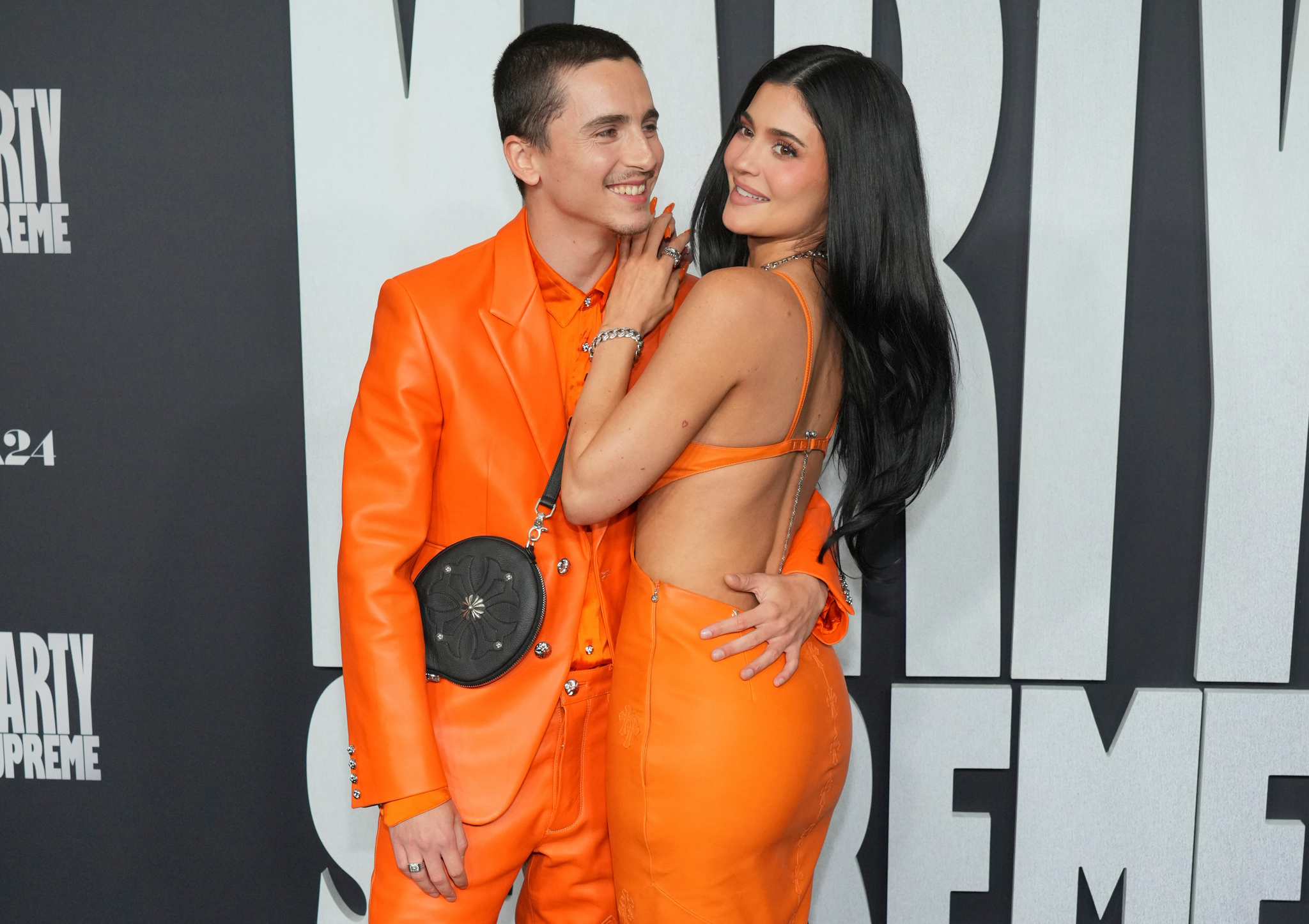 Timothee Chalamet and Kylie Jenner pose together for photos during the premiere of Marty Supreme in Los Angeles, California.