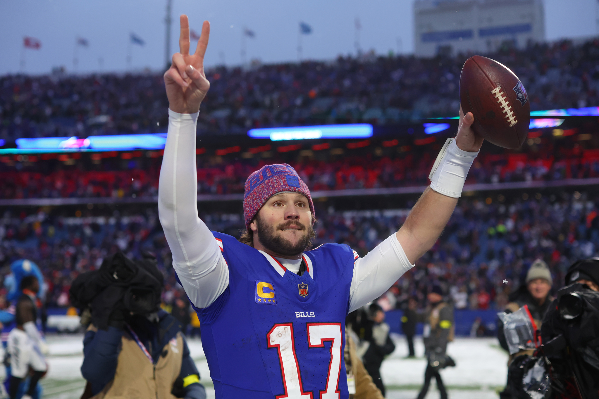 Buffalo Bills quarterback Josh Allen gestures as he walks from the field after an NFL football game against the Cincinnati Bengals