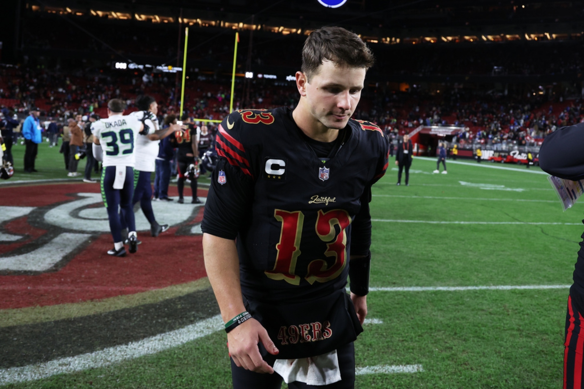 Brock Purdy (13) walks off the field after an NFL football game against the Seattle Seahawks.