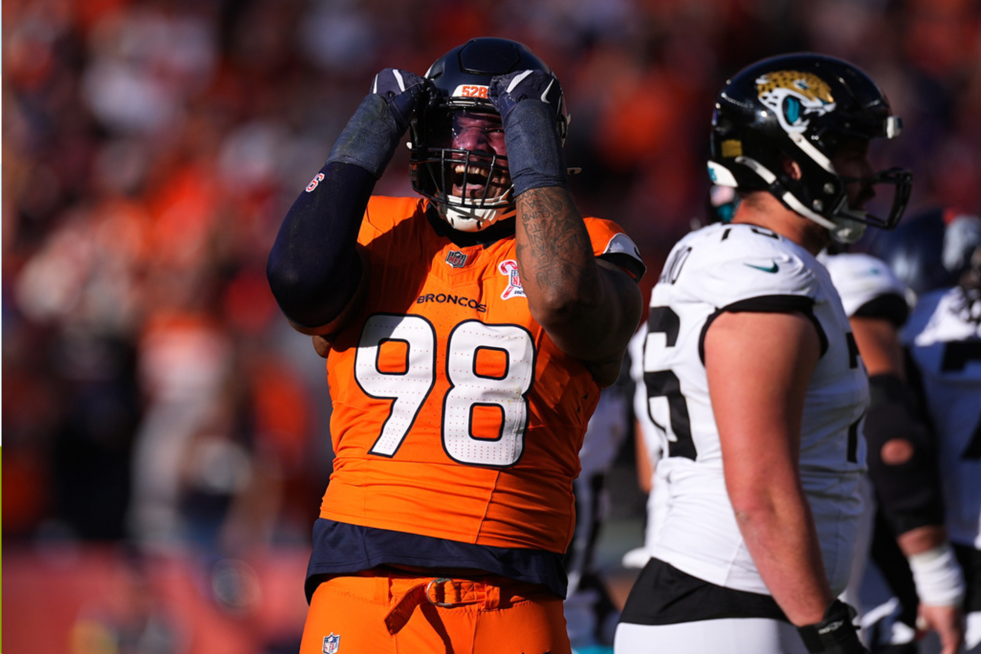 Denver Broncos defensive end John Franklin-Myers (98) celebrates after sacking Jacksonville Jaguars quarterback Trevor Lawrence (not pictured)