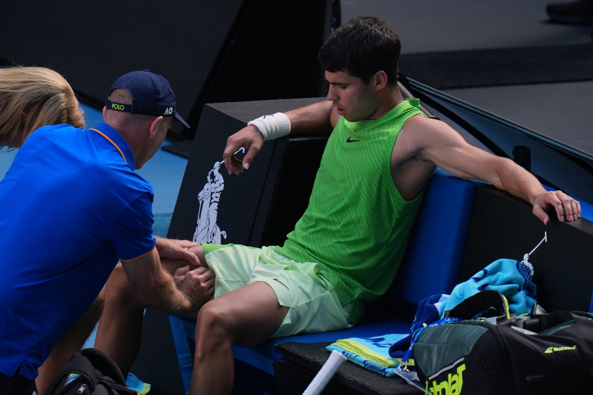 Alcaraz receives treatment during his semifinal match against Zverev.