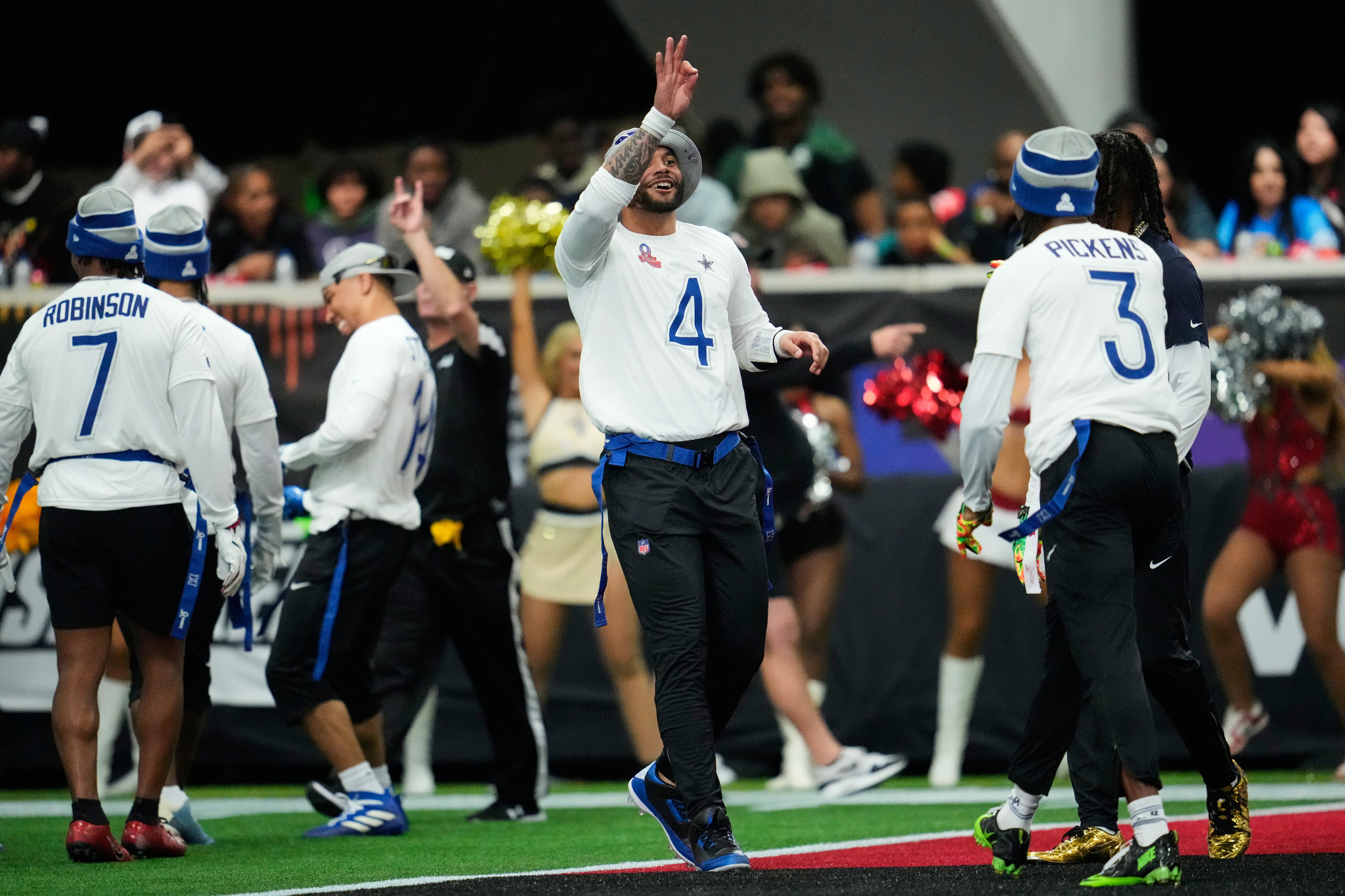 NFC quarterback Dak Prescott (4), of the Dallas Cowboys, celebrates after throwing a touchdown pass against the AFC during the second half of the NFL Pro Bowl football game, Tuesday, Feb. 3, 2026, in San Francisco. (AP Photo/Godofredo A. V�squez)