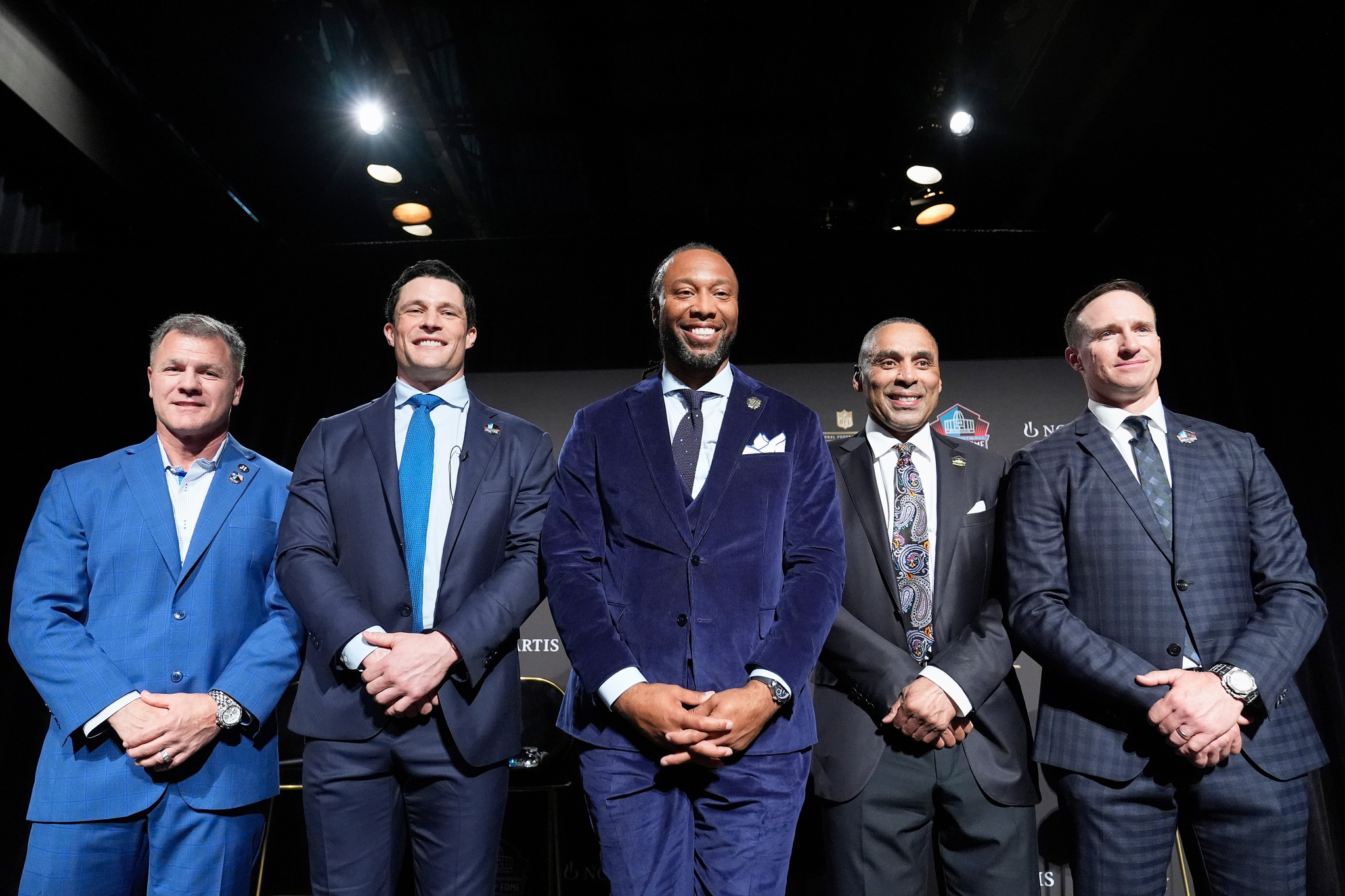 Adam Vinatieri, from left, stands with Luke Kuechly, Larry Fitzgerald, Roger Craig and Drew Brees after being announced for the Pro Football Hall of Fame