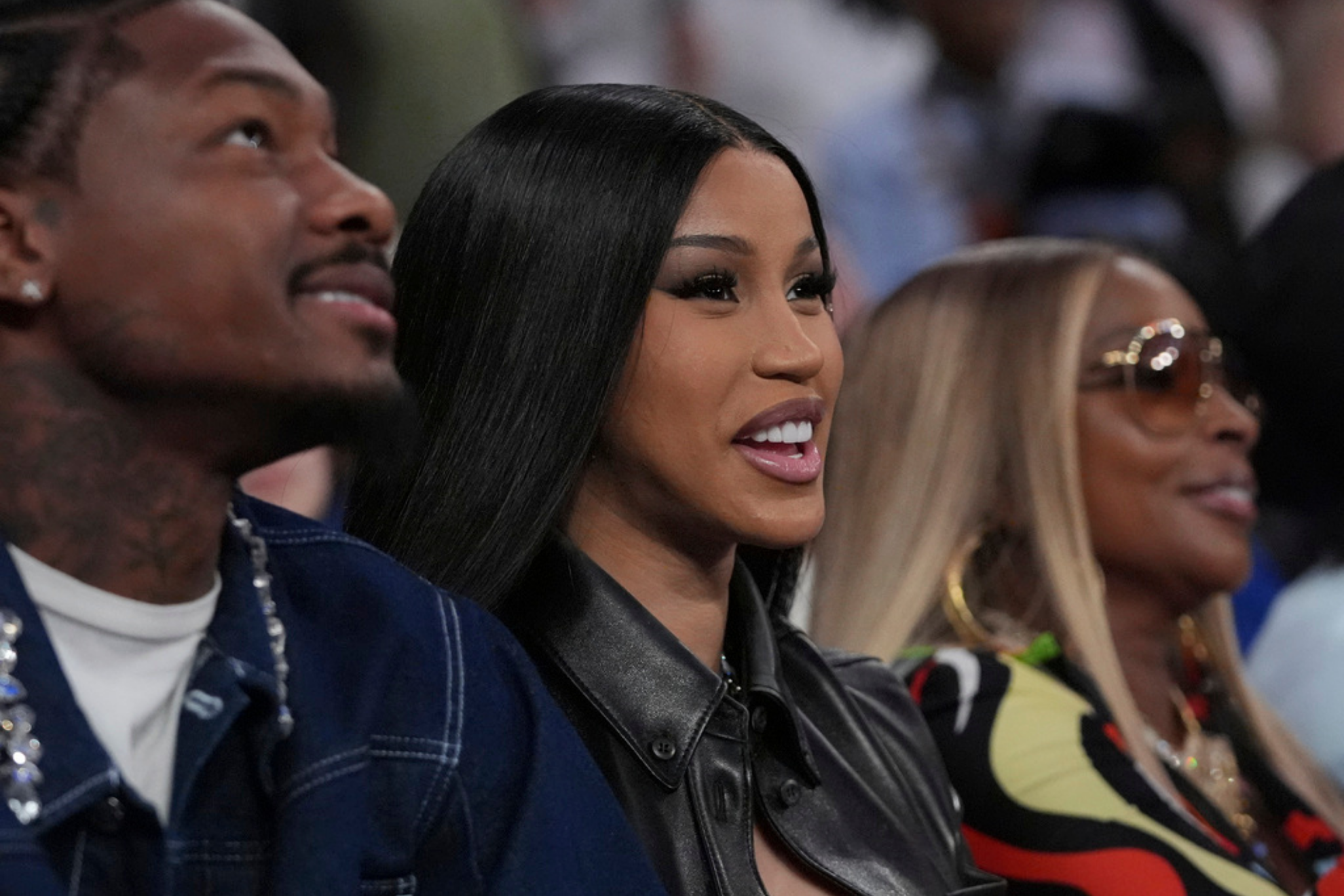 Cardi B, center, Stefon Diggs, left