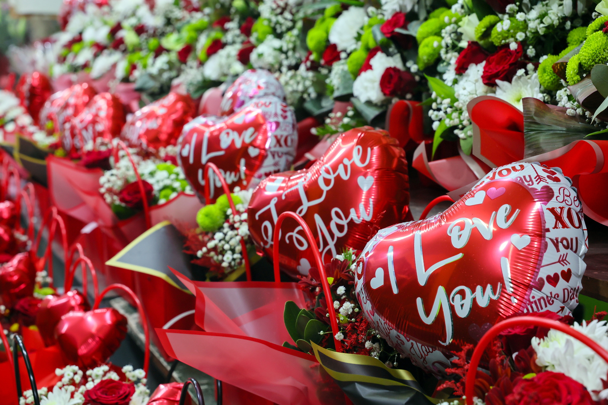 Flowers and balloons are displayed for sale in a shop ahead of Valentines Day