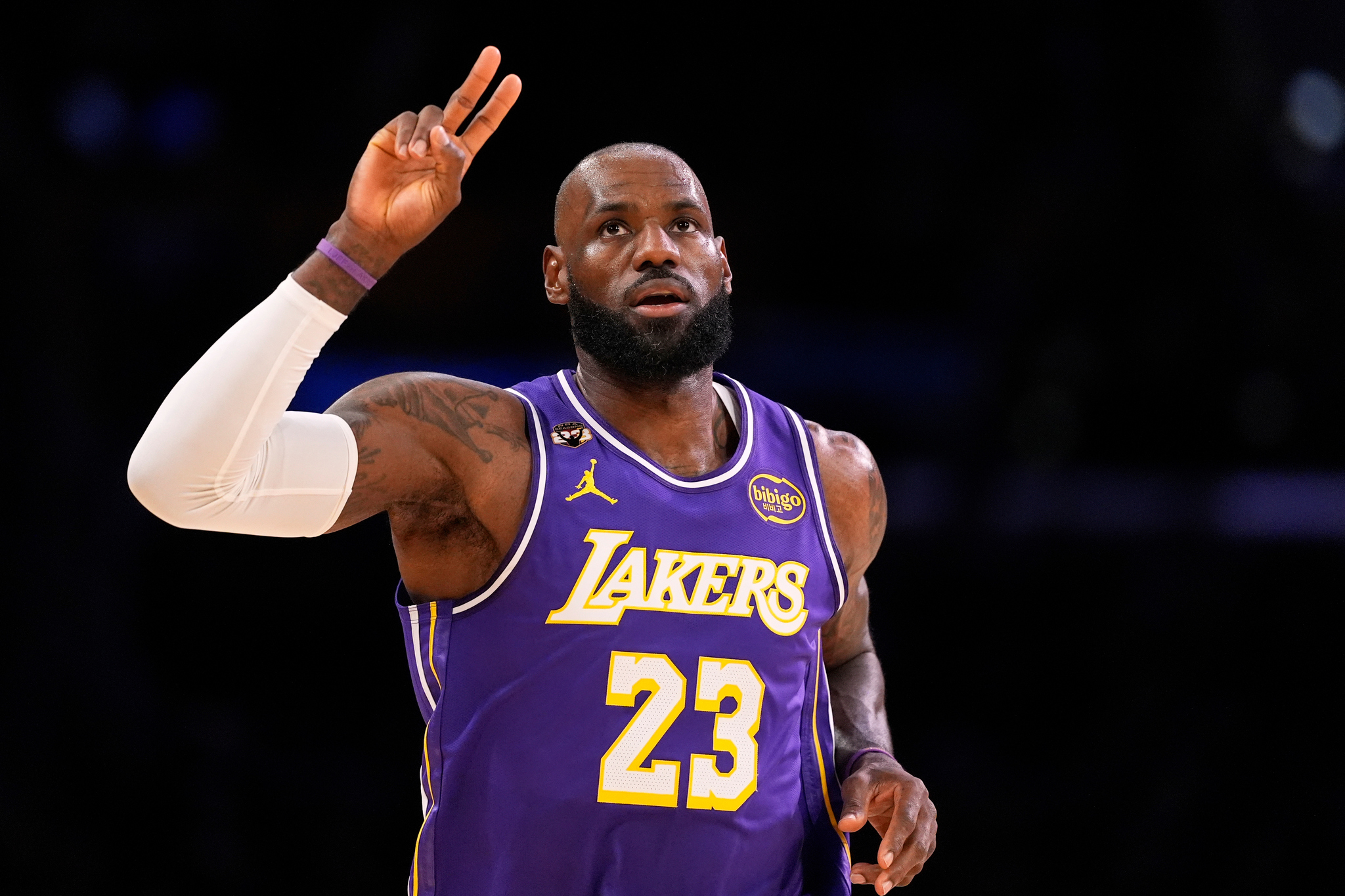 Los Angeles Lakers forward LeBron James gestures after scoring during an NBA basketball game against the Dallas Mavericks