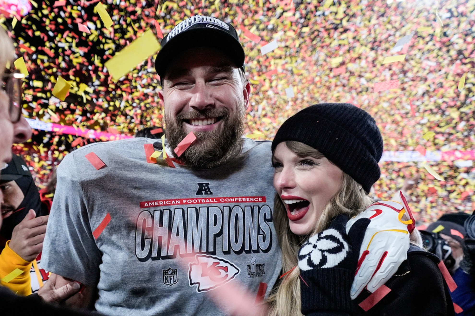 Travis Kelce, left, and Taylor Swift pose after the AFC Championship NFL football game