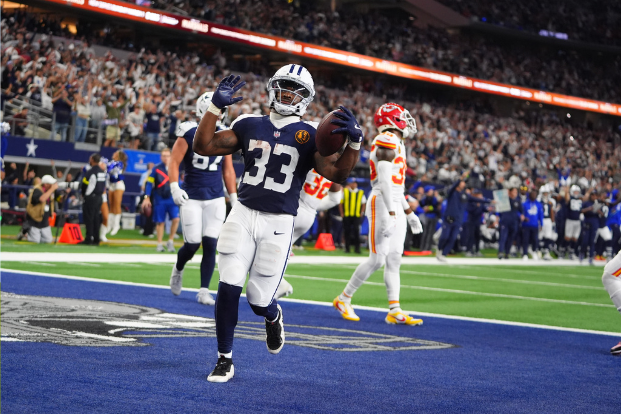 Dallas Cowboys running back Javonte Williams (33) celebrates after scoring during the second half of an NFL football