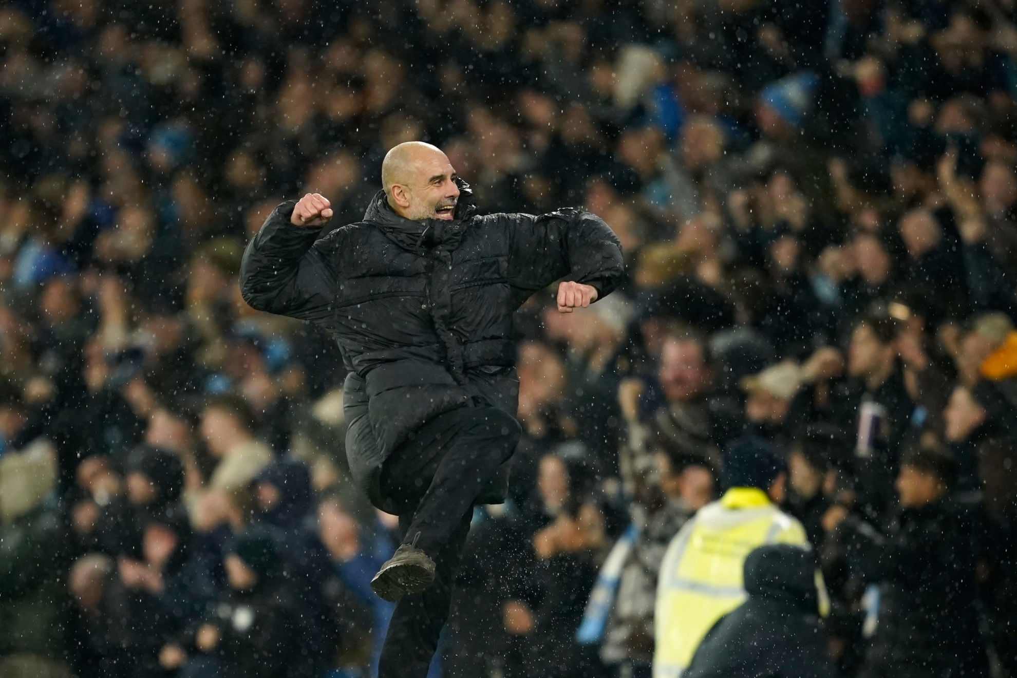 Pep Guardiola celebrates after Manchester Citys Erling Haaland scoring his sides third goal.