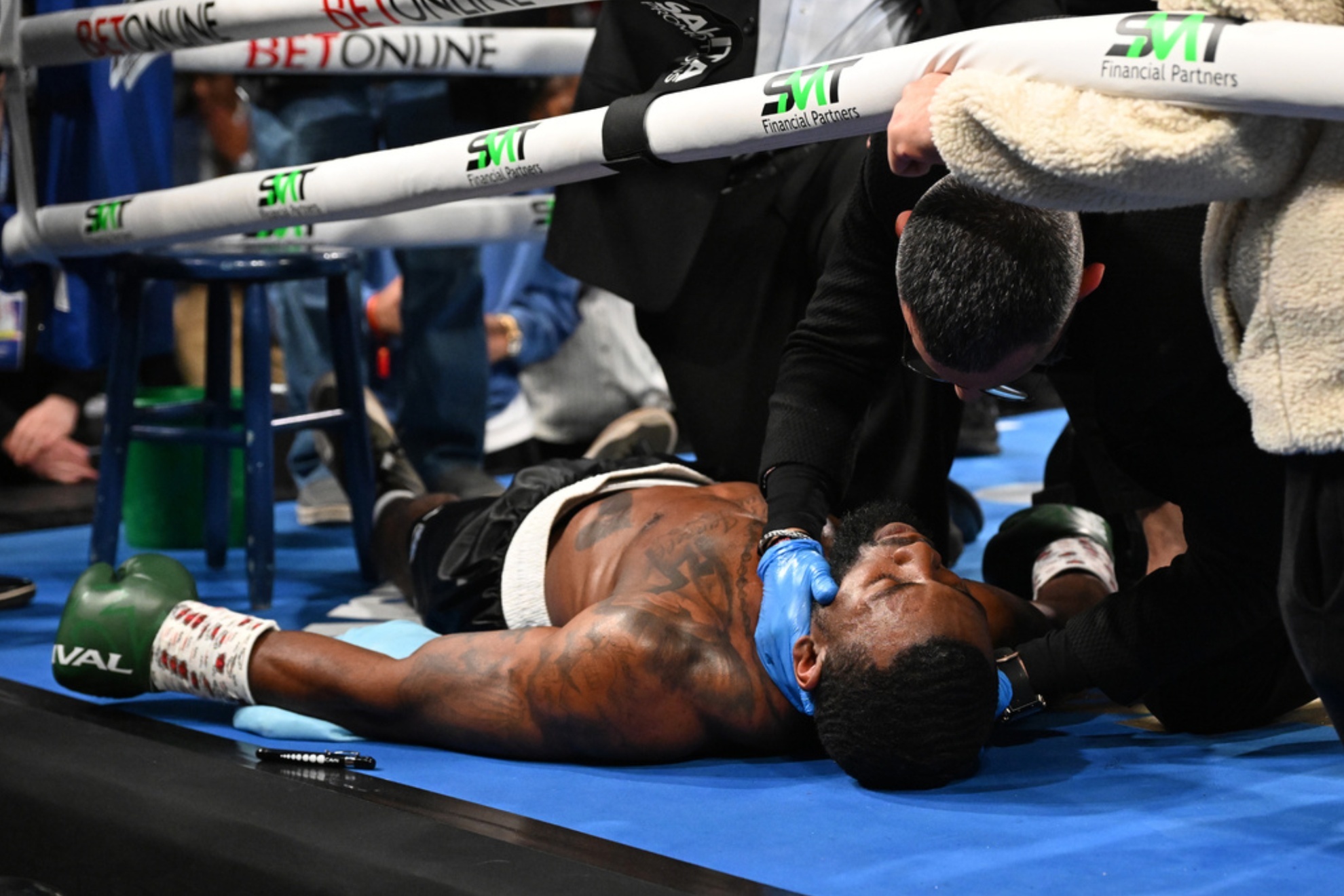 Joe George Jr. was stretchered out after fainting in his corner during a Detroit boxing match.