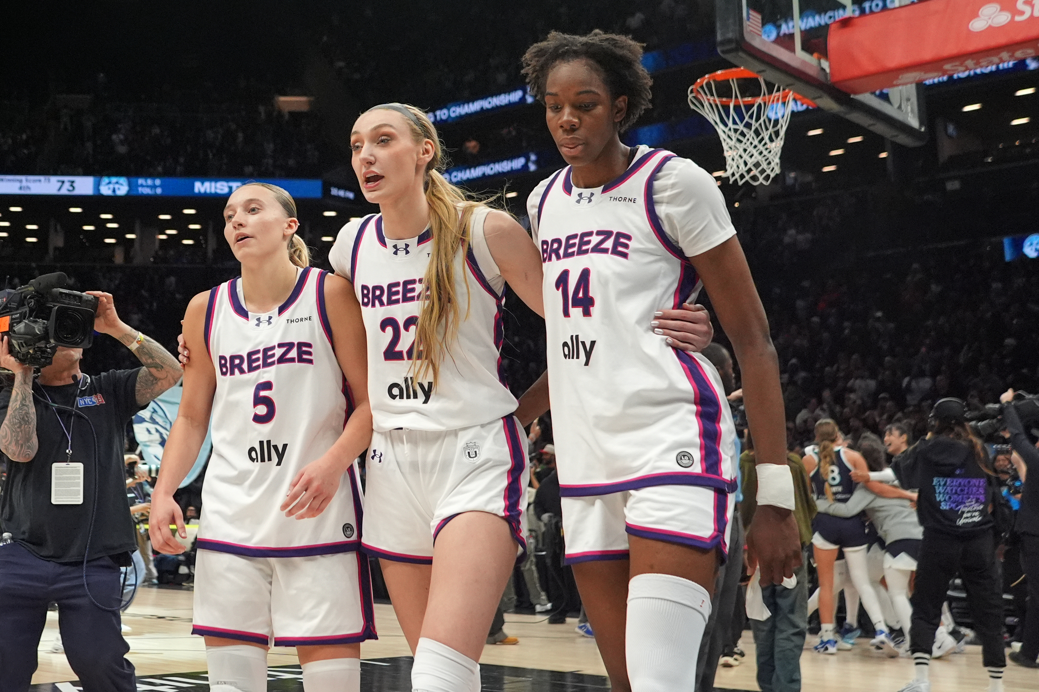 Breeze BC guard Paige Bueckers (5), forward Cameron Brink (22) and forward Dominique Malonga (14) leave the court after the semifinal of an Unrivaled 3-on-3 basketball game against Mist BC
