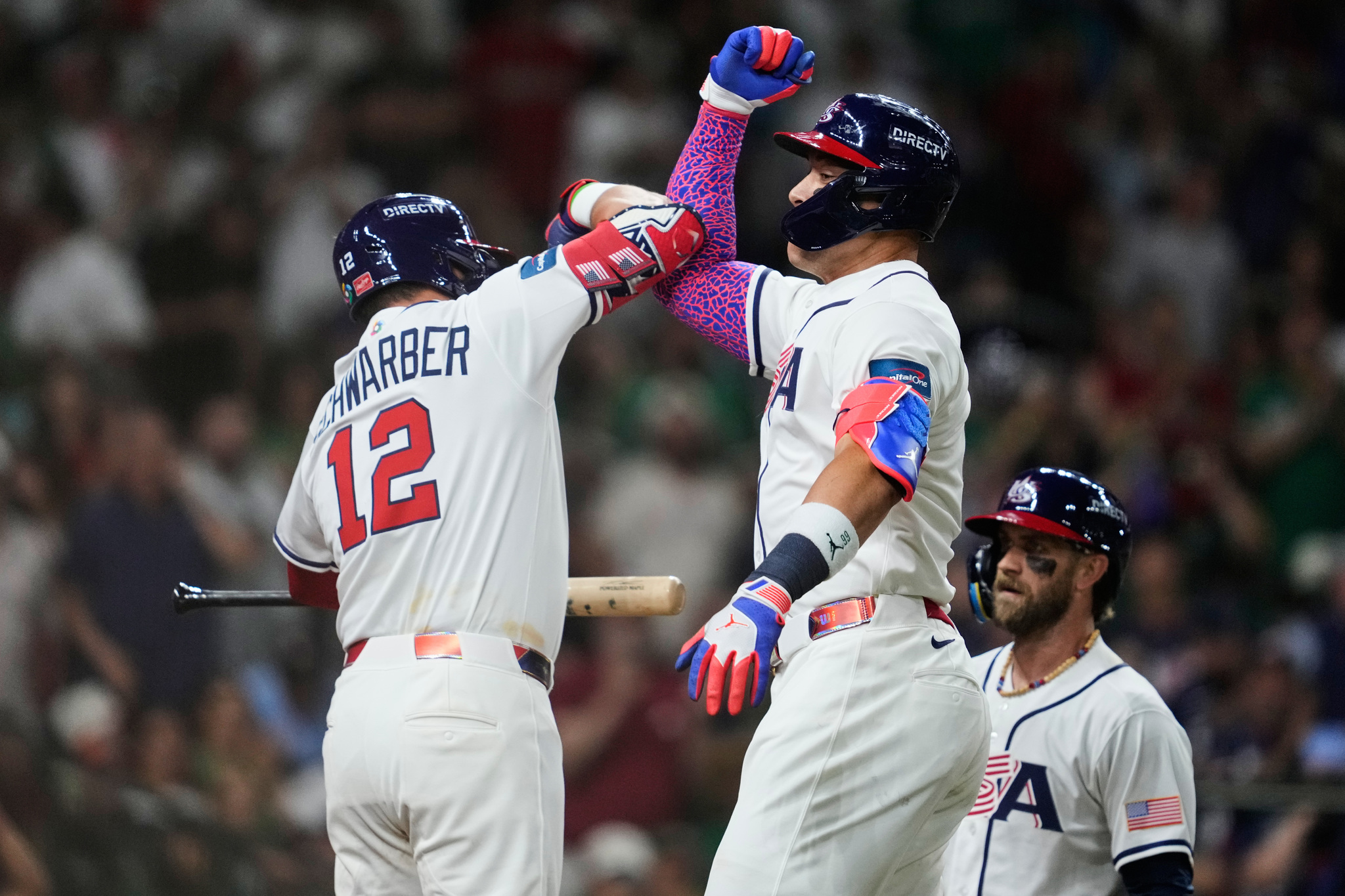 United States Aaron Judge, center, celebrates with Kyle Schwarber, left, after hitting a two-run home run