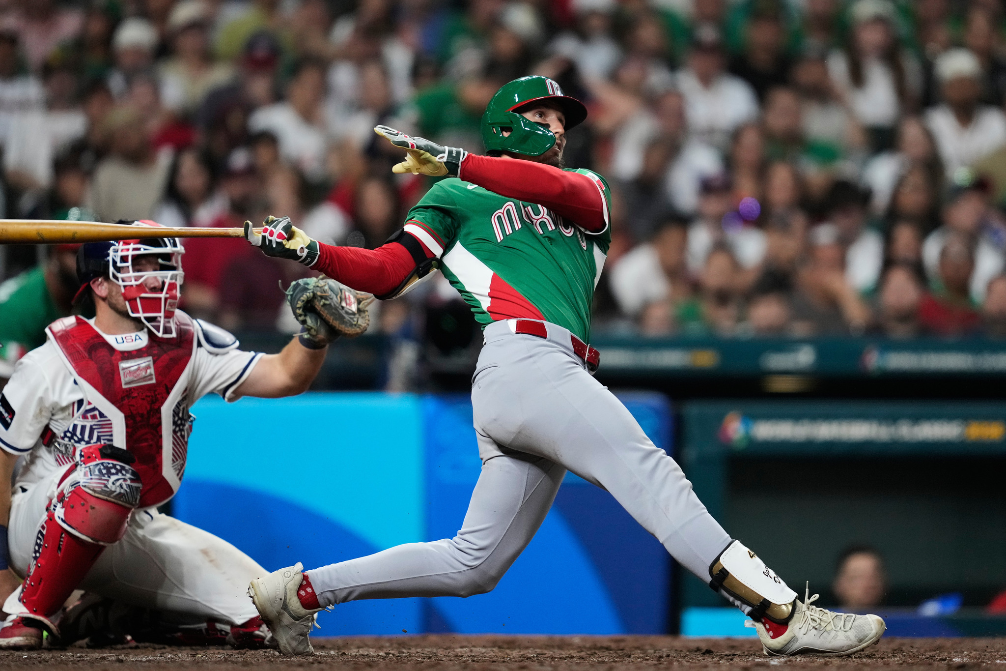 Mexicos Jarren Duran, right, hits a solo home run during the eighth inning of a World Baseball Classic game