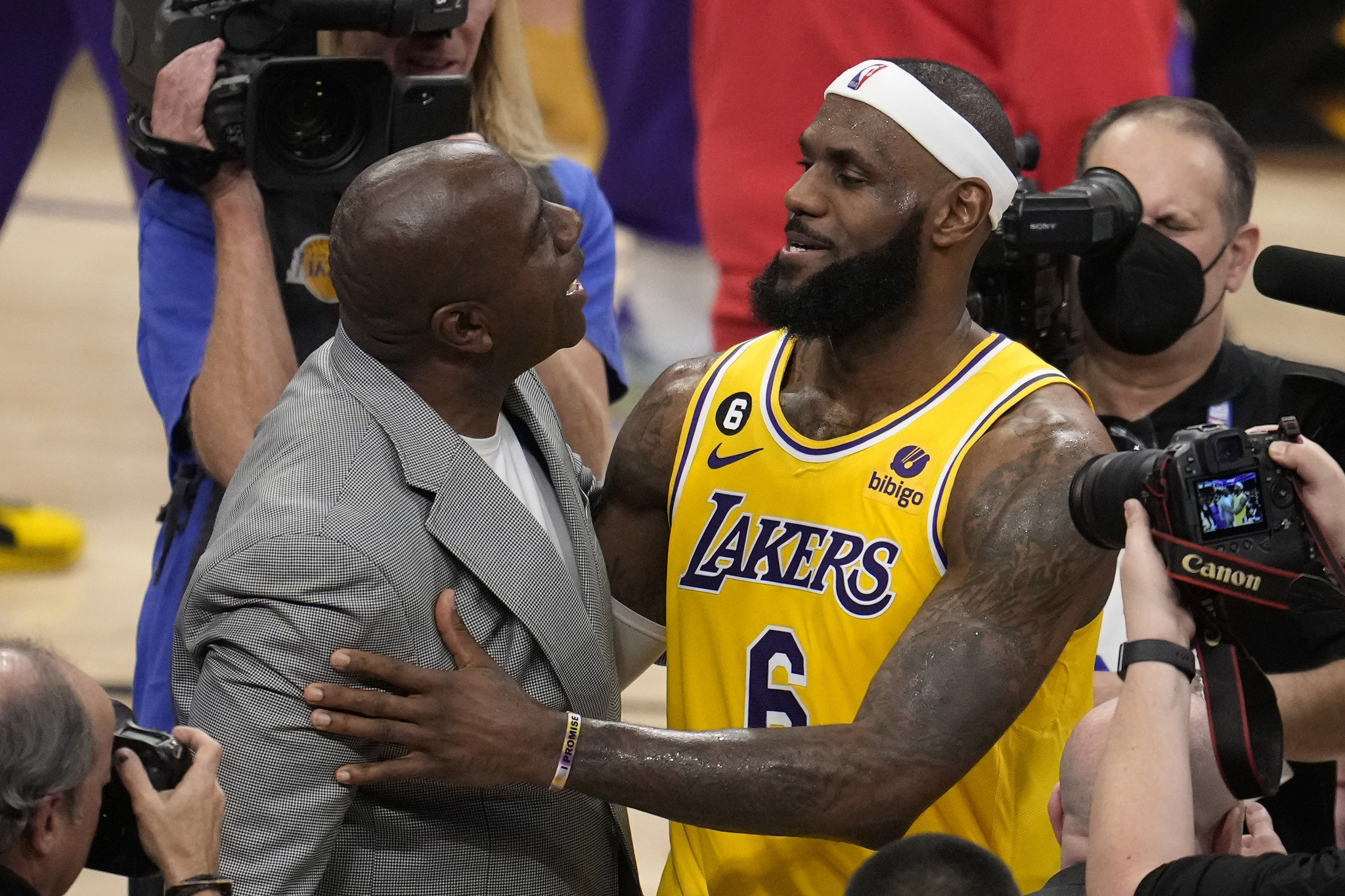 Magic Johnson congratulates LeBron James after James passed Kareem Abdul-Jabbar to become the NBAs all-time leading scorer