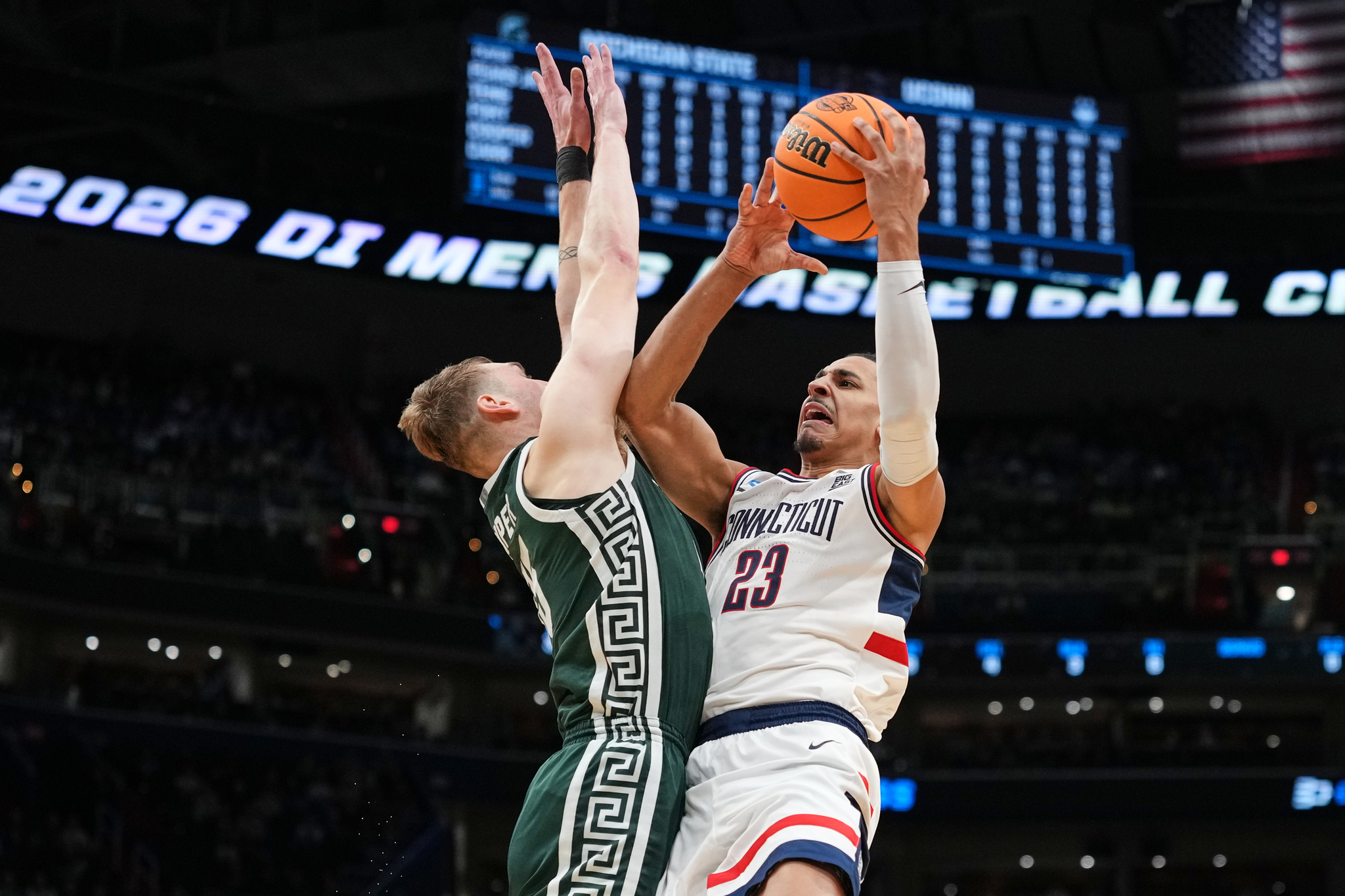 UConn forward Jayden Ross (23) shoots over Michigan State center Carson Cooper (15) during the second half in the Sweet 16