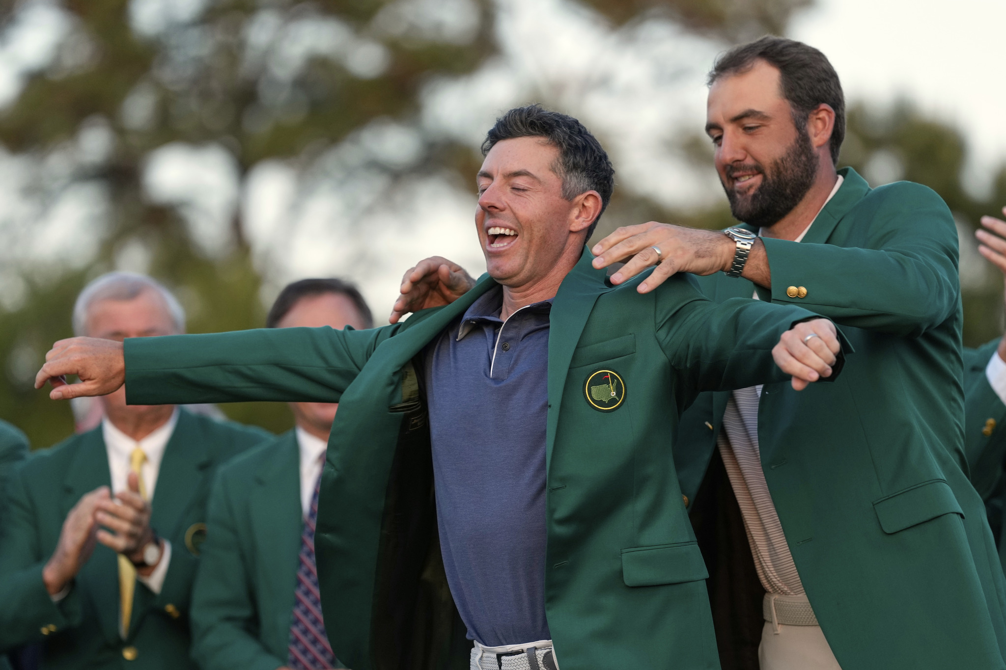 Scottie Scheffler graces Rory McIlroy with the green jacket after the latter won the 2025 Masters Tournament.