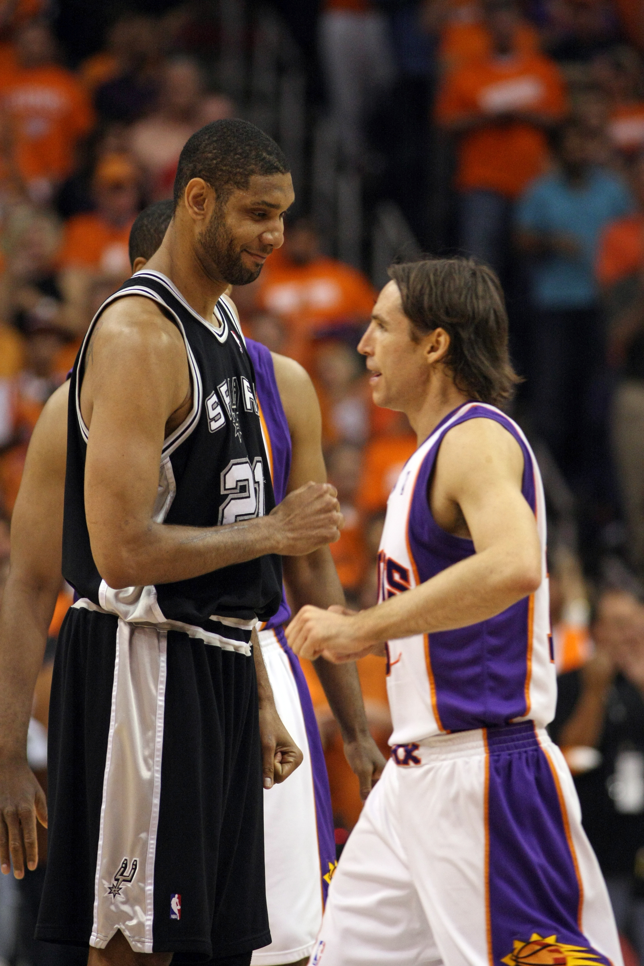 Phoenix Suns guard Steve Nash, right, greets San Antonio Spurs center Tim Duncan during the NBA playoffs May 3, 2010 in Phoenix
