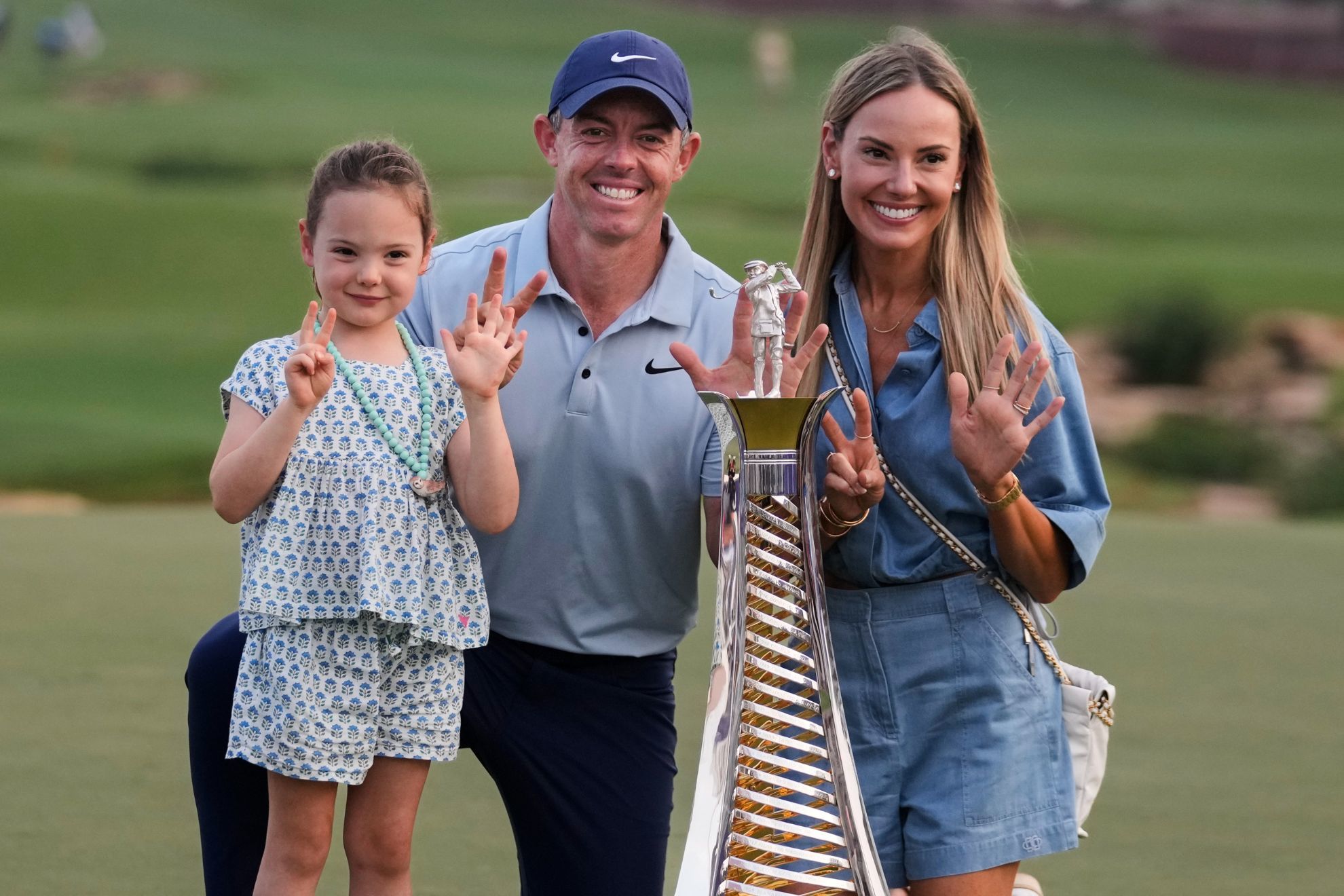 Rory McIlroy of Northern Ireland poses with his wife, Erica Stoll and daughter Poppy.