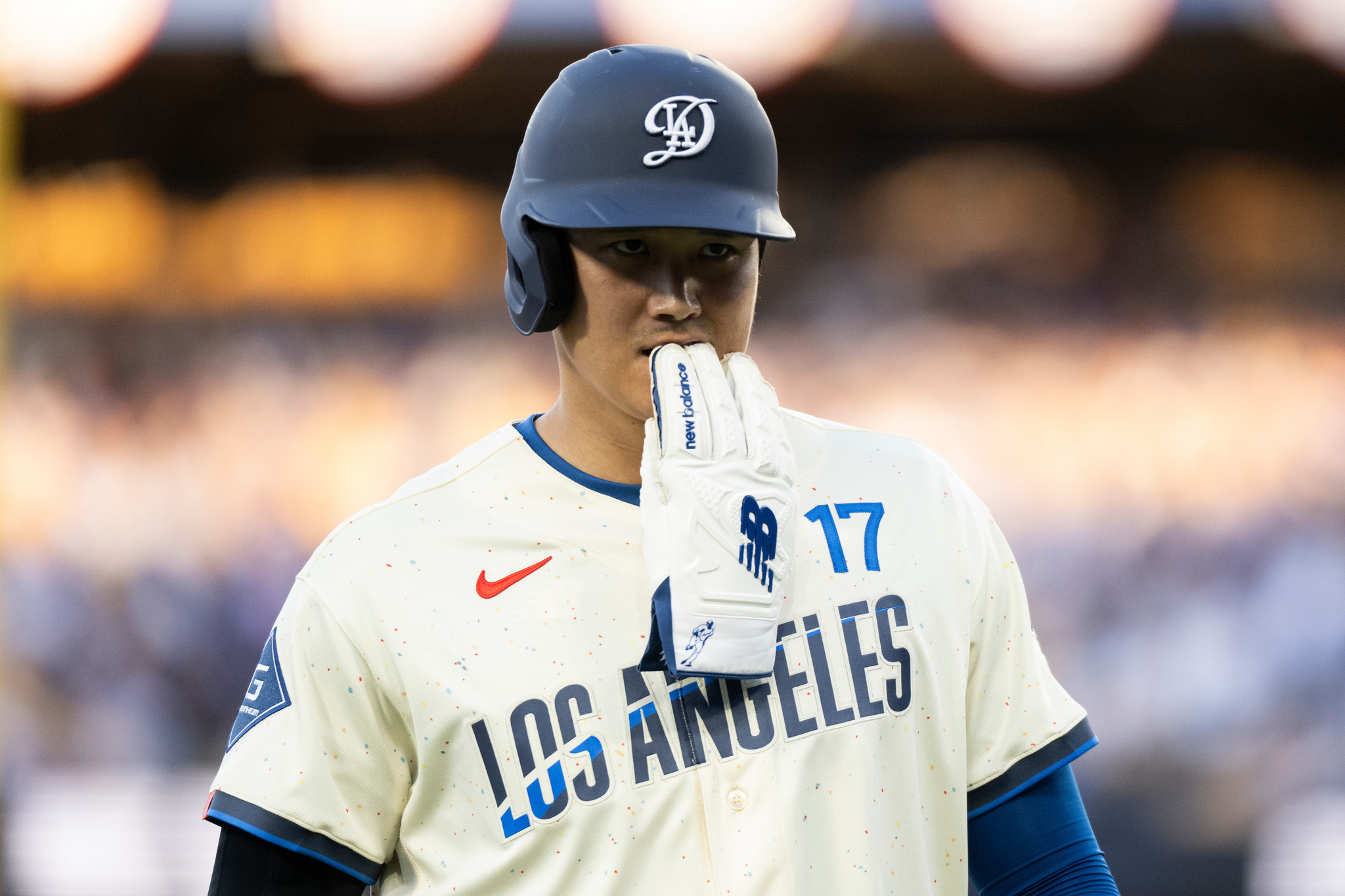 Los Angeles Dodgers Shohei Ohtani walks back to the dugout during the second inning of a baseball game against the Texas Rangers in Los Angeles