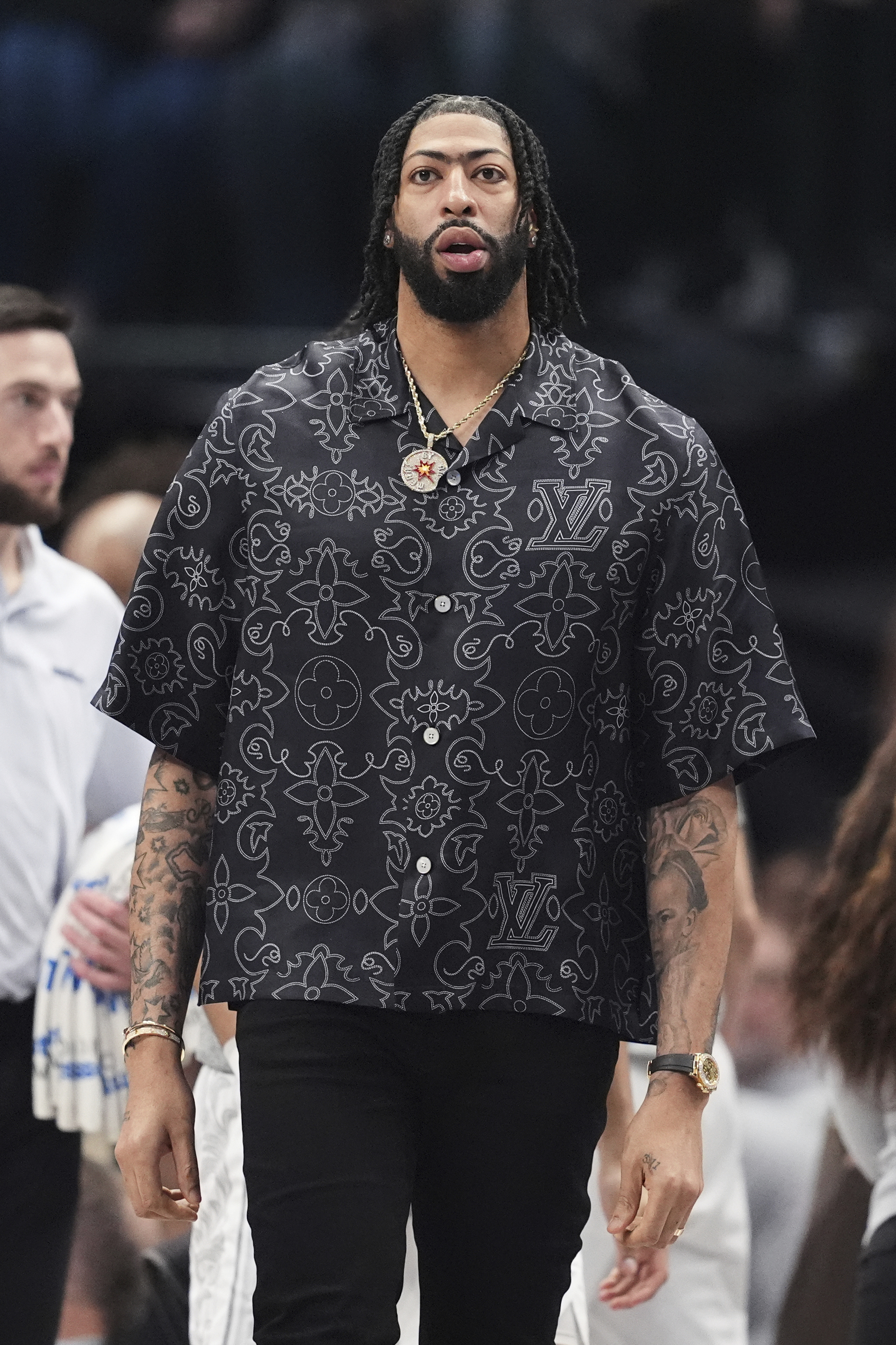 Former Dallas Mavericks forward Anthony Davis walks onto the court during a timeout against Milwaukee Bucks