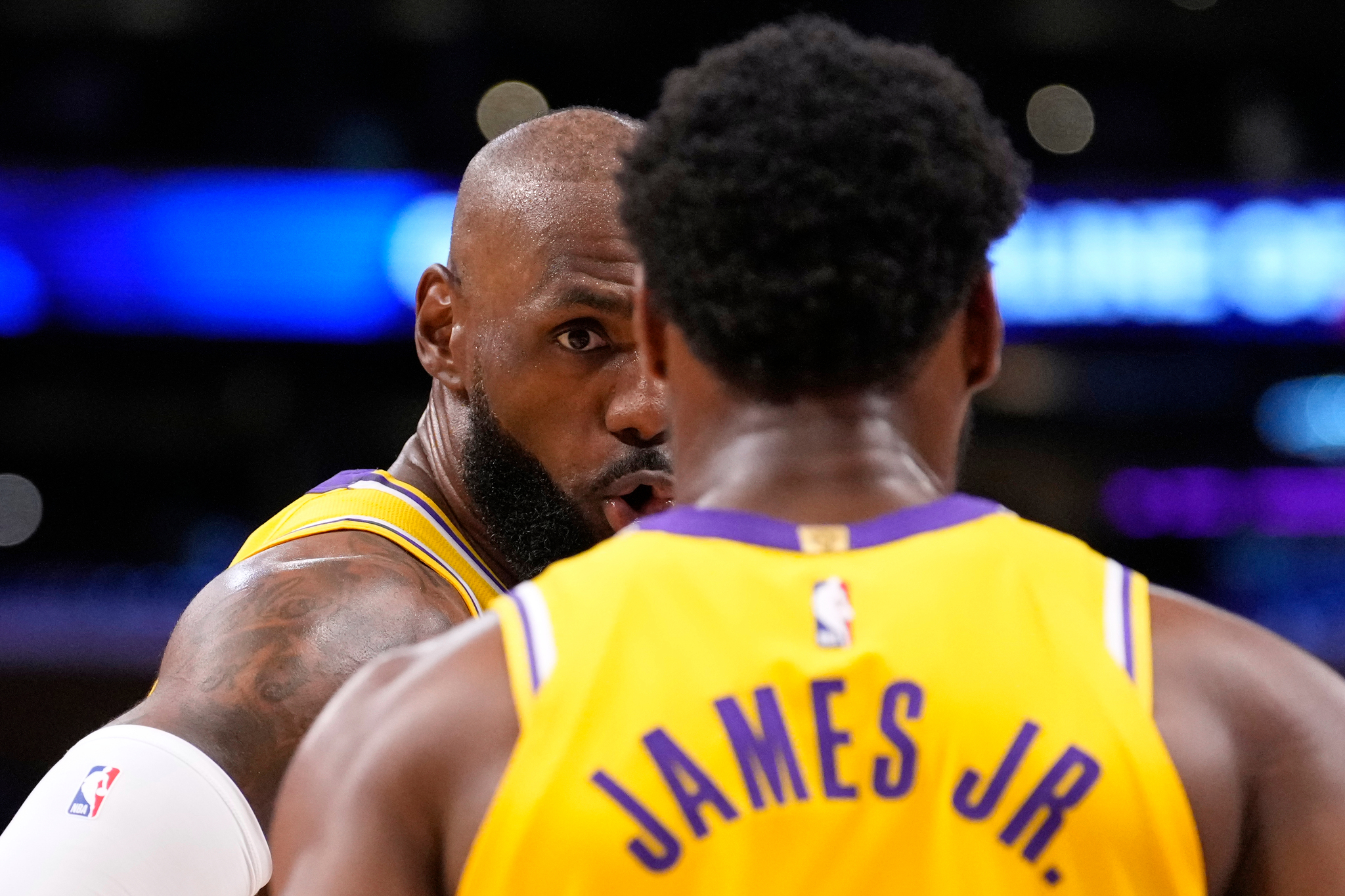 LeBron and Bronny in game.