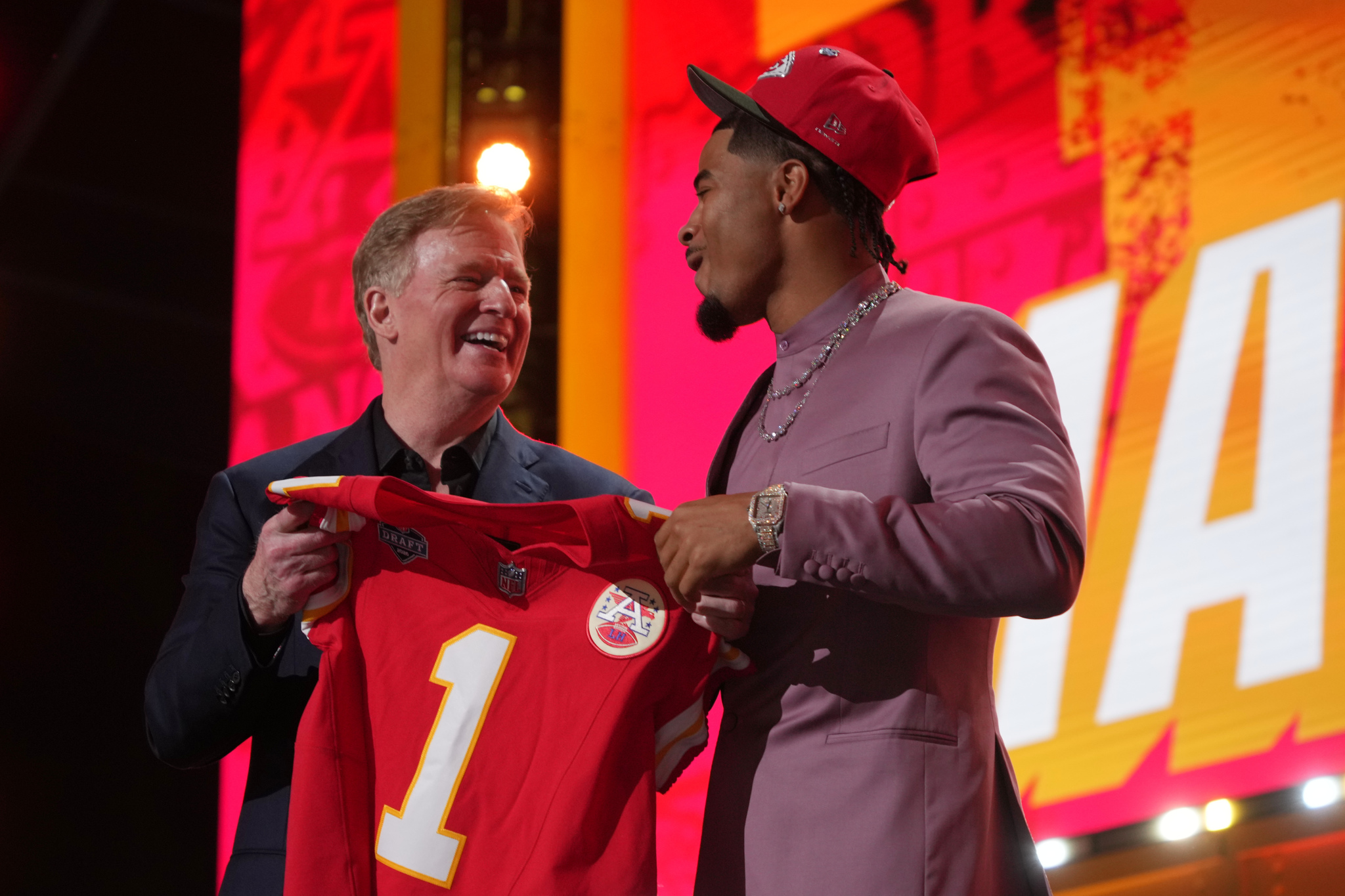 LSU defensive back Mansoor Delane, right, reacts with NFL Commissioner Roger Goodell after being chosen by the Kansas City Chiefs