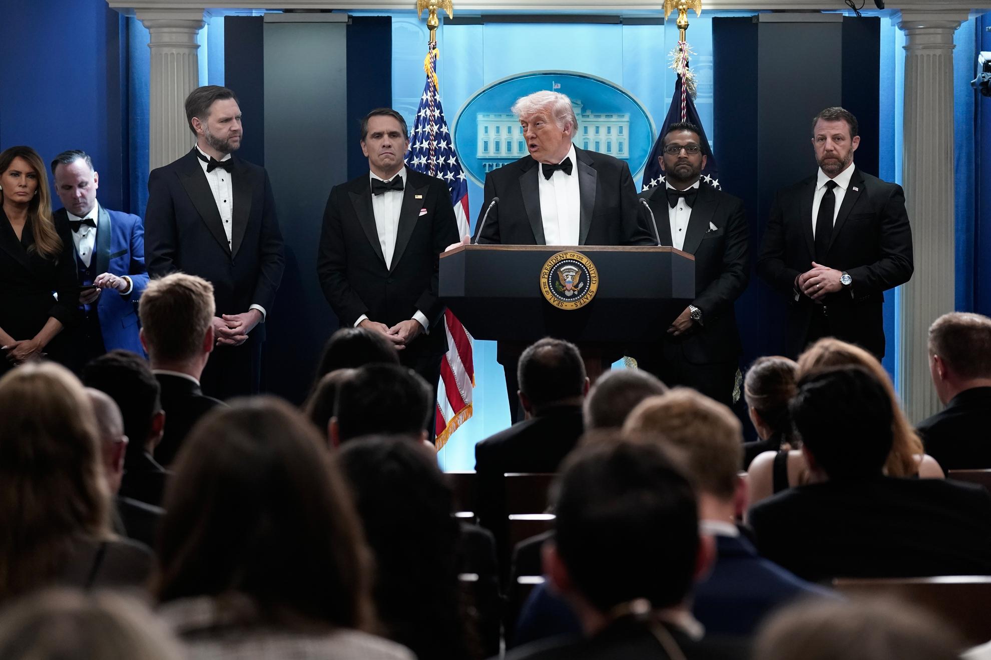 President Donald Trump speaks with White House deputy chief of staff Dan Scavino, Vice President JD Vance, acting Attorney General Todd Blanche, FBI director Kash Patel and Homeland Security Secretary Markwayne Mullin