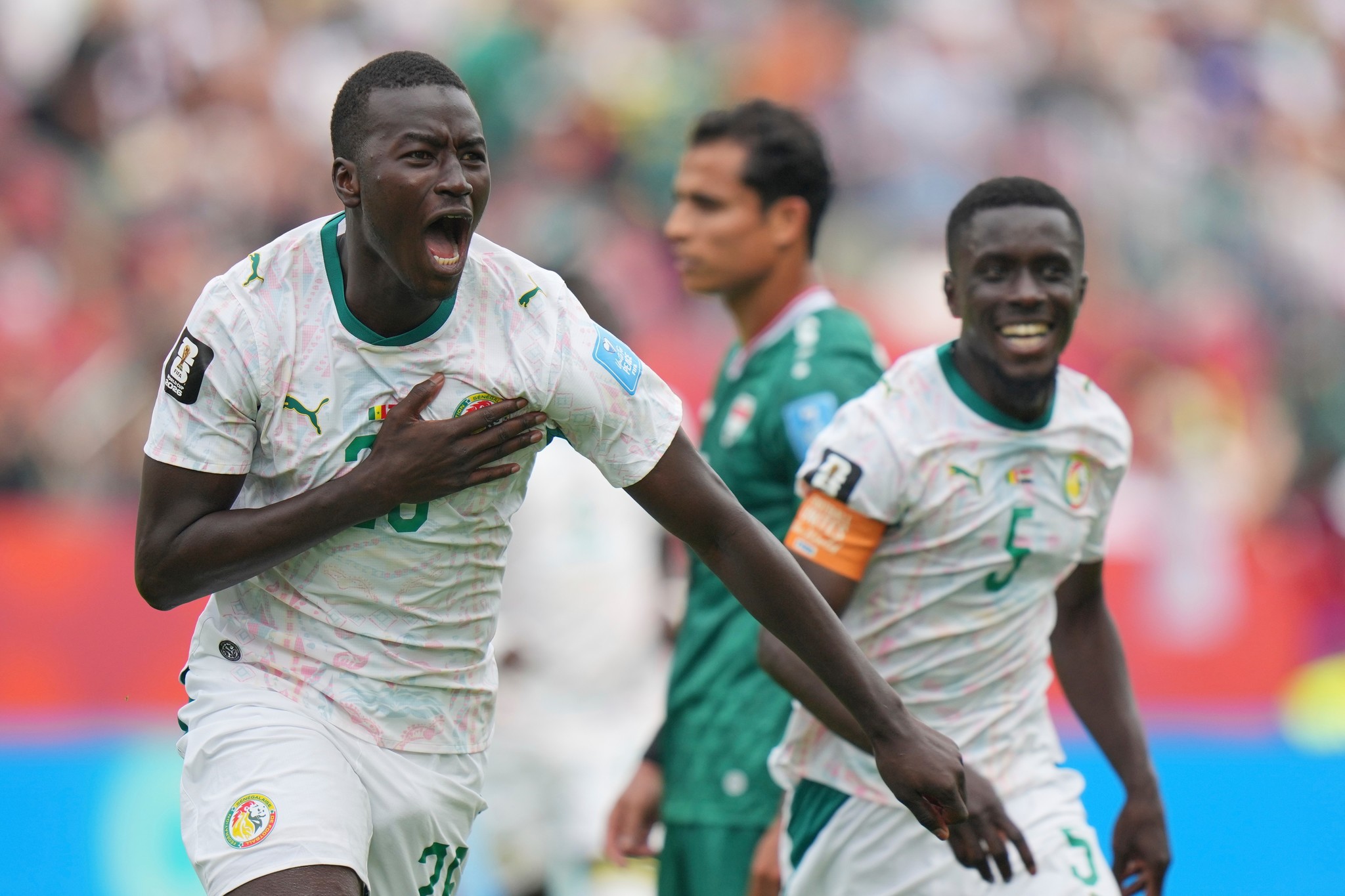 Senegal's  lt;HIT gt;Pape lt;/HIT gt;  lt;HIT gt;Gueye lt;/HIT gt; (26) celebrates their third goal during the World Cup Group I soccer match between Senegal and Iraq in Toronto, Friday, June 26, 2026. (AP Photo/Stephanie Scarbrough)