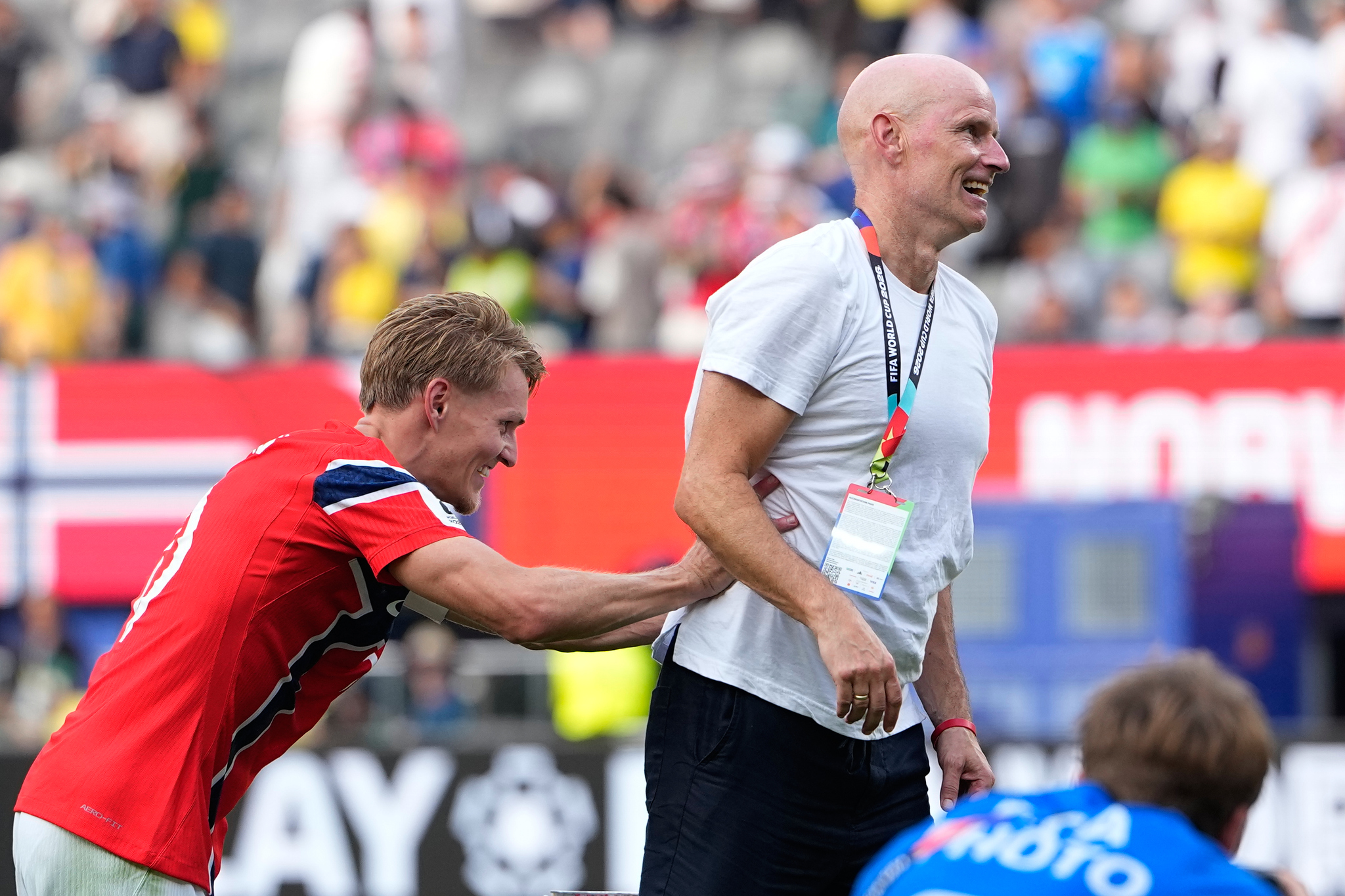 Norway's Martin Oedegaard (10) jokes with Norway head coach Stale lt;HIT gt;Solbakken lt;/HIT gt; after the World Cup round of 16 soccer match between Brazil and Norway in East Rutherford, N.J., near New York, Sunday, July 5, 2026. (AP Photo/Frank Franklin II)